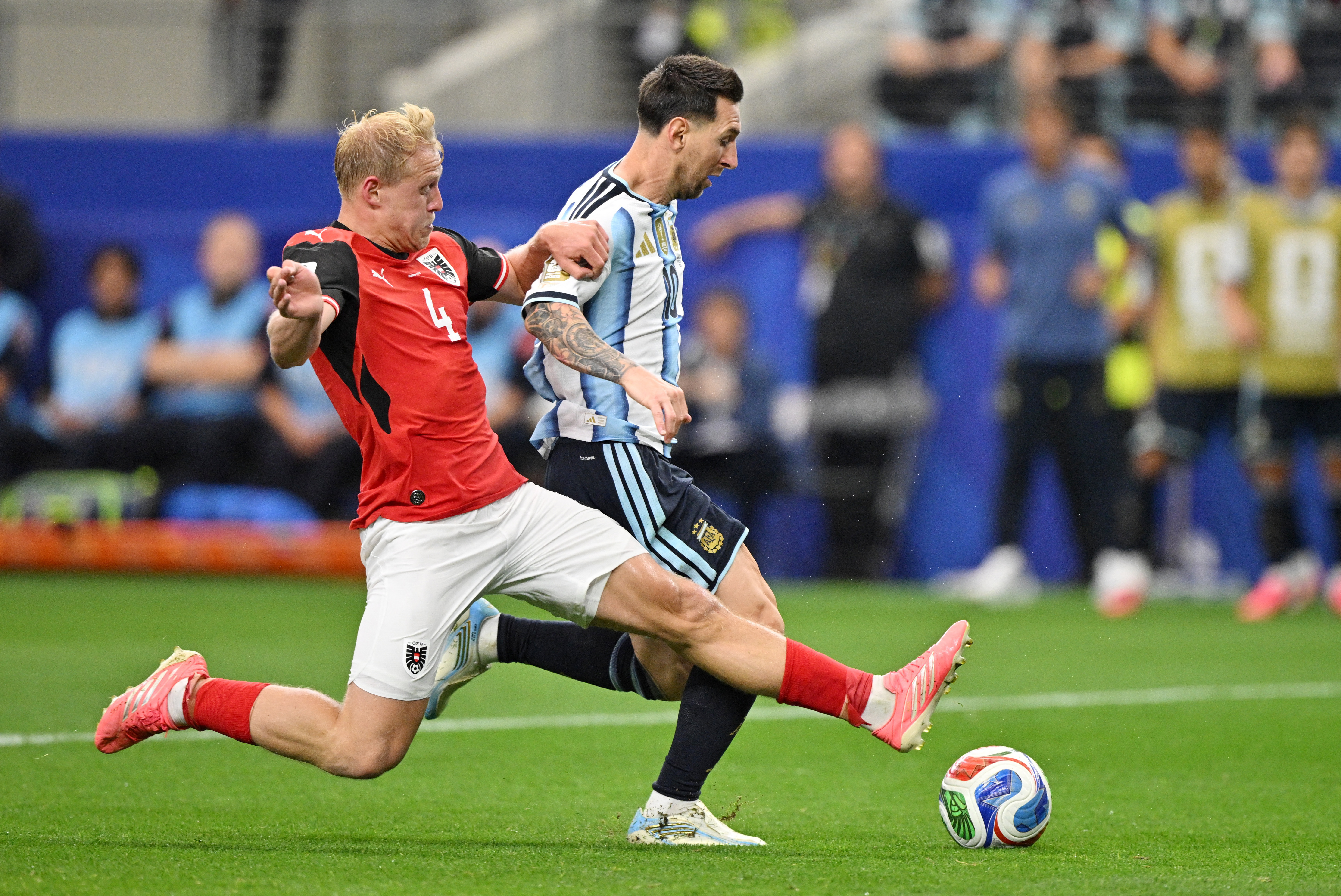 Soccer Football - FIFA World Cup 2026 - Group J - Argentina v Austria - Dallas Stadium, Arlington, Texas, U.S. - June 22, 2026 Austria's Xaver Schlager in action with Argentina's Lionel Messi IMAGN IMAGES via Reuters/Jerome Miron
