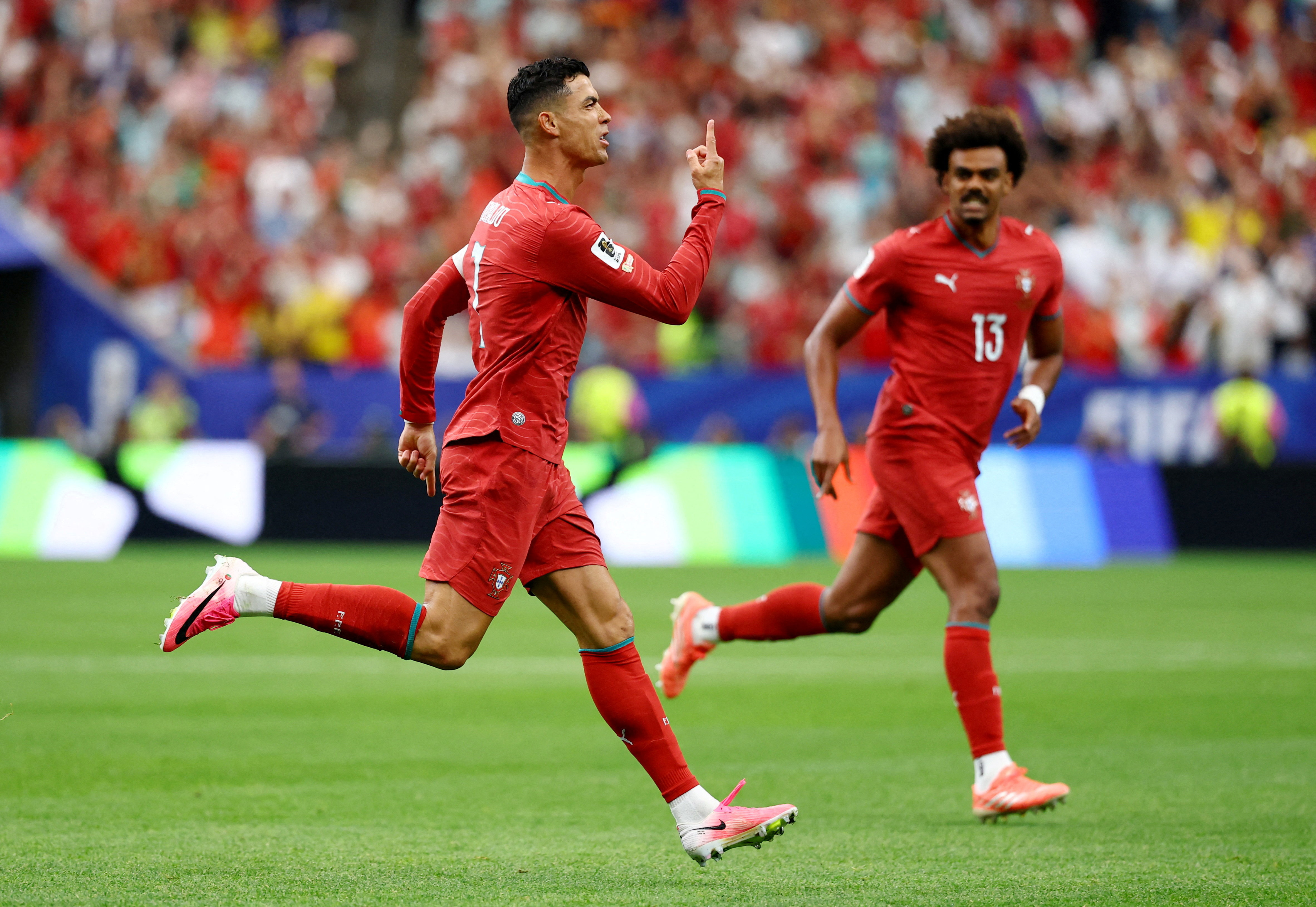 Soccer Football - FIFA World Cup 2026 - Group K - Portugal v Uzbekistan - Houston Stadium, Houston, Texas, U.S. - June 23, 2026 Portugal's Cristiano Ronaldo celebrates scoring their first goal with Renato Veiga REUTERS/Pedro Nunes     TPX IMAGES OF THE DA