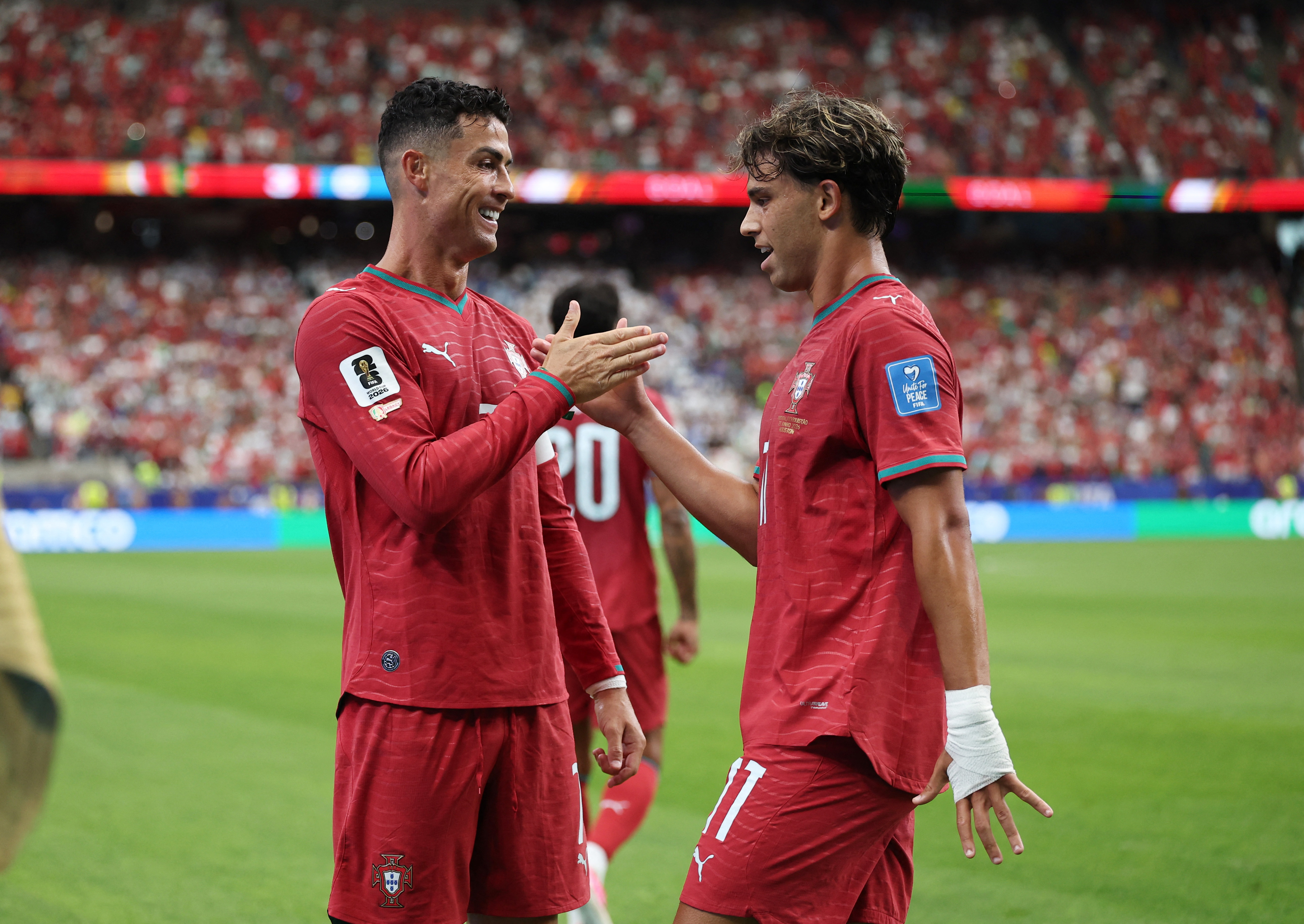 Soccer Football - FIFA World Cup 2026 - Group K - Portugal v Uzbekistan - Houston Stadium, Houston, Texas, U.S. - June 23, 2026 Portugal's Cristiano Ronaldo celebrates scoring their third goal with Joao Felix IMAGN IMAGES via Reuters/Troy Taormina