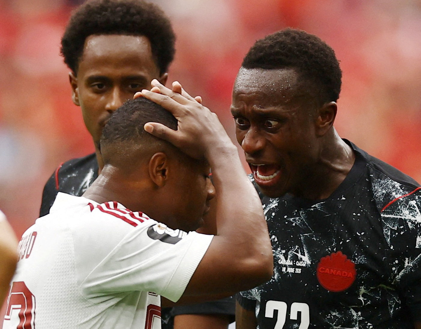 Soccer Football - FIFA World Cup 2026 - Group B - Canada v Qatar - BC Place, Vancouver, Canada - June 18, 2026 Canada's Richie Laryea shouts at Qatar's Assim Madibo after his challenge that injured Canada's Ismael Kone REUTERS/Lee Smith     TPX IMAGES OF