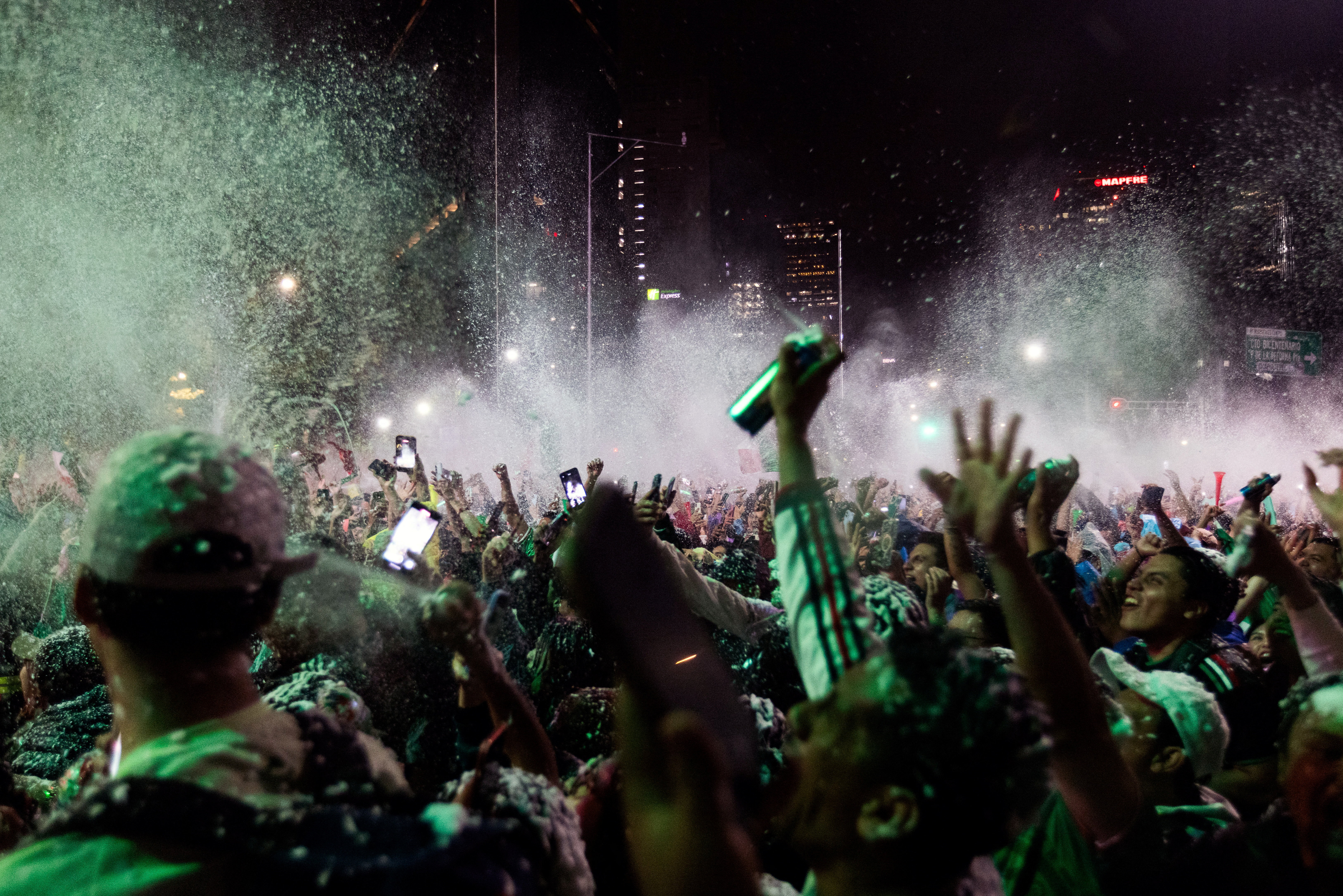 Fans celebrate Mexico's 2-0 victory over Ecuador in the Round of 3