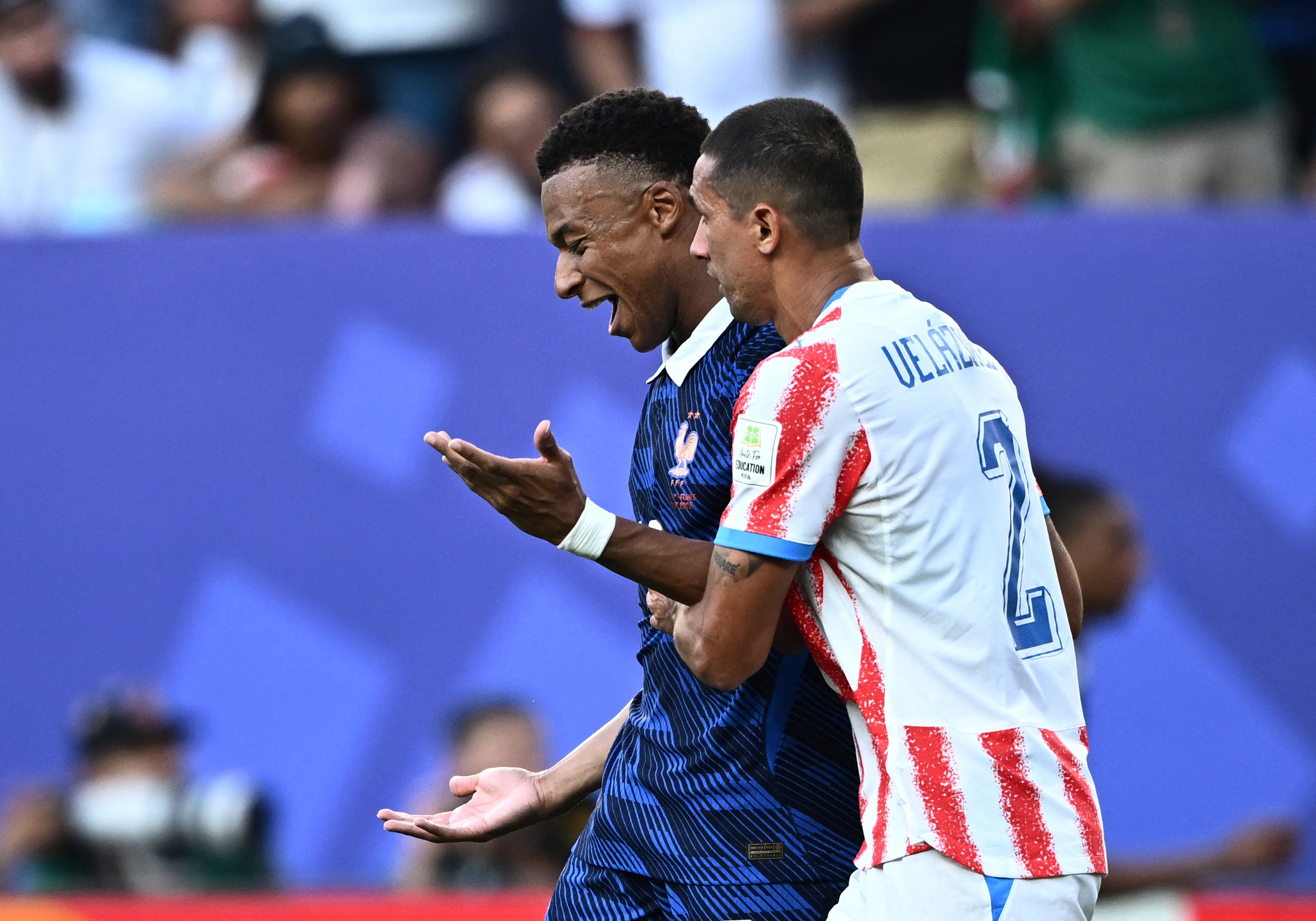 Soccer Football - FIFA World Cup 2026 - Round of 16 - Paraguay v France - Philadelphia Stadium, Philadelphia, Pennsylvania, U.S. - July 4, 2026 France's Kylian Mbappe reacts with Paraguay's Gustavo Velazquez REUTERS/Dylan Martinez