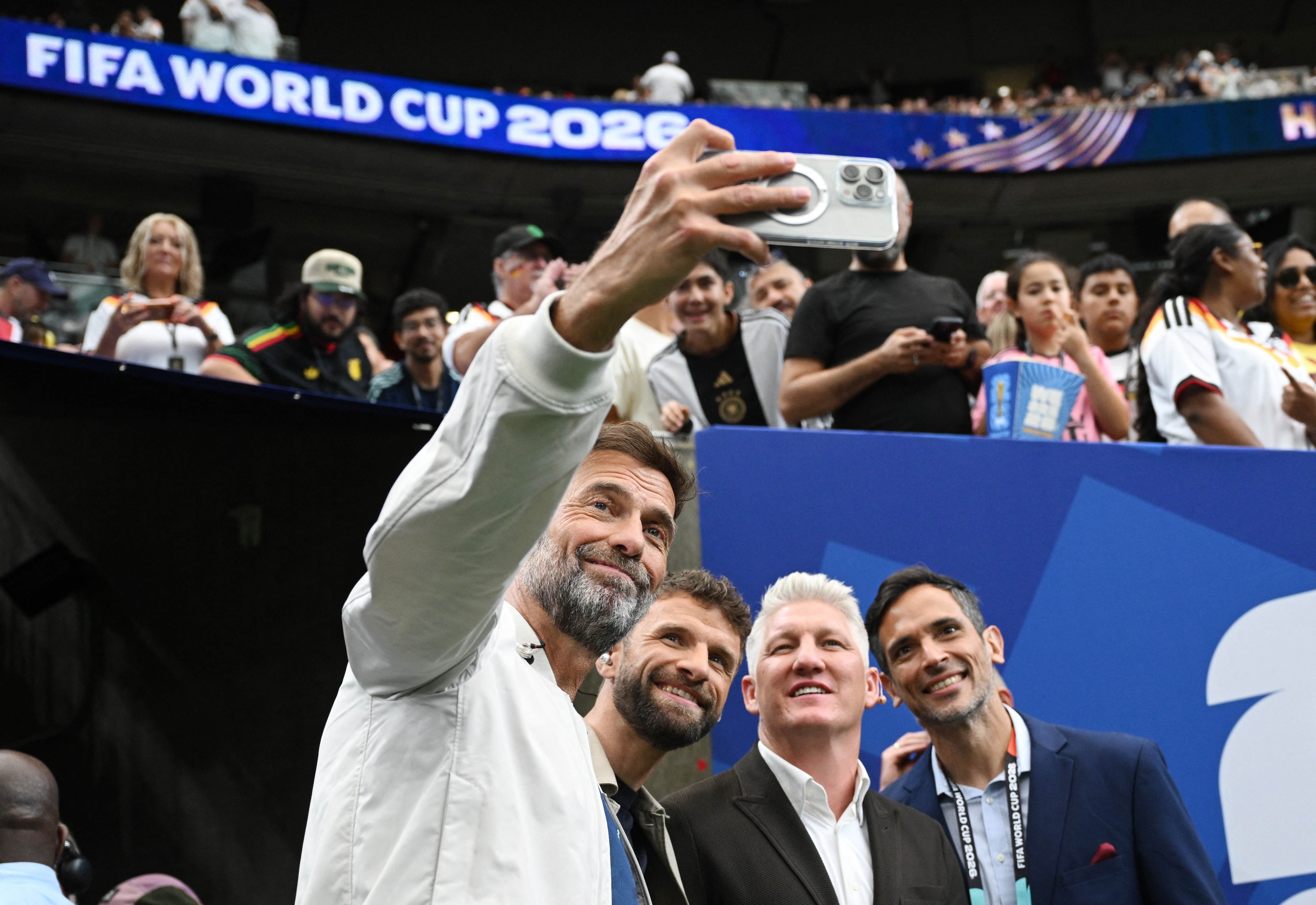 Soccer Football - FIFA World Cup 2026 - Group E - Germany v Curacao - Houston Stadium, Houston, Texas, U.S. - June 14, 2026 Former manager and players Juergen Klopp, Thomas Muller, Bastian Schweinsteiger and Roque Santa Cruz pose for a selfie REUTERS/Anne