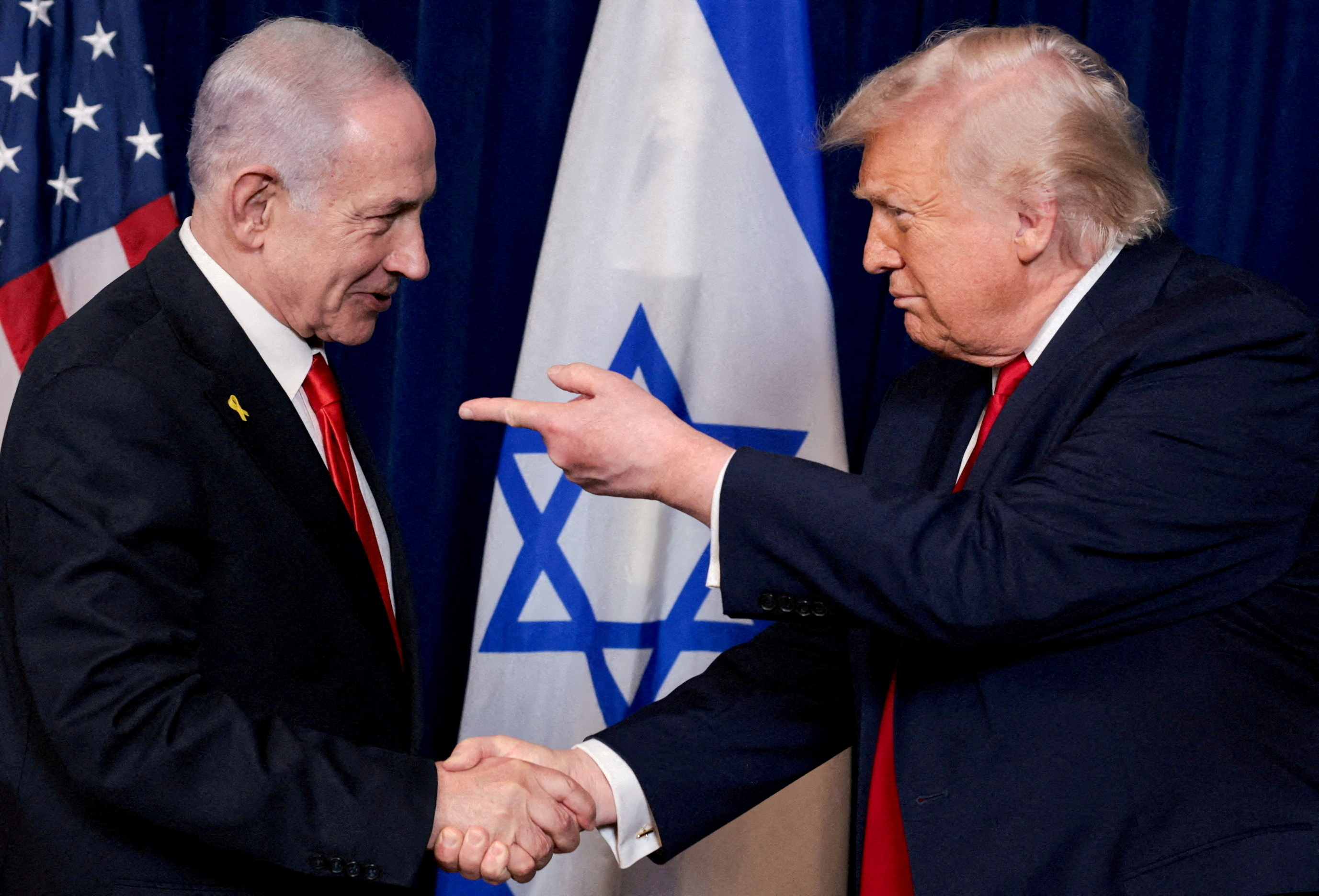 FILE PHOTO: U.S. President Donald Trump points