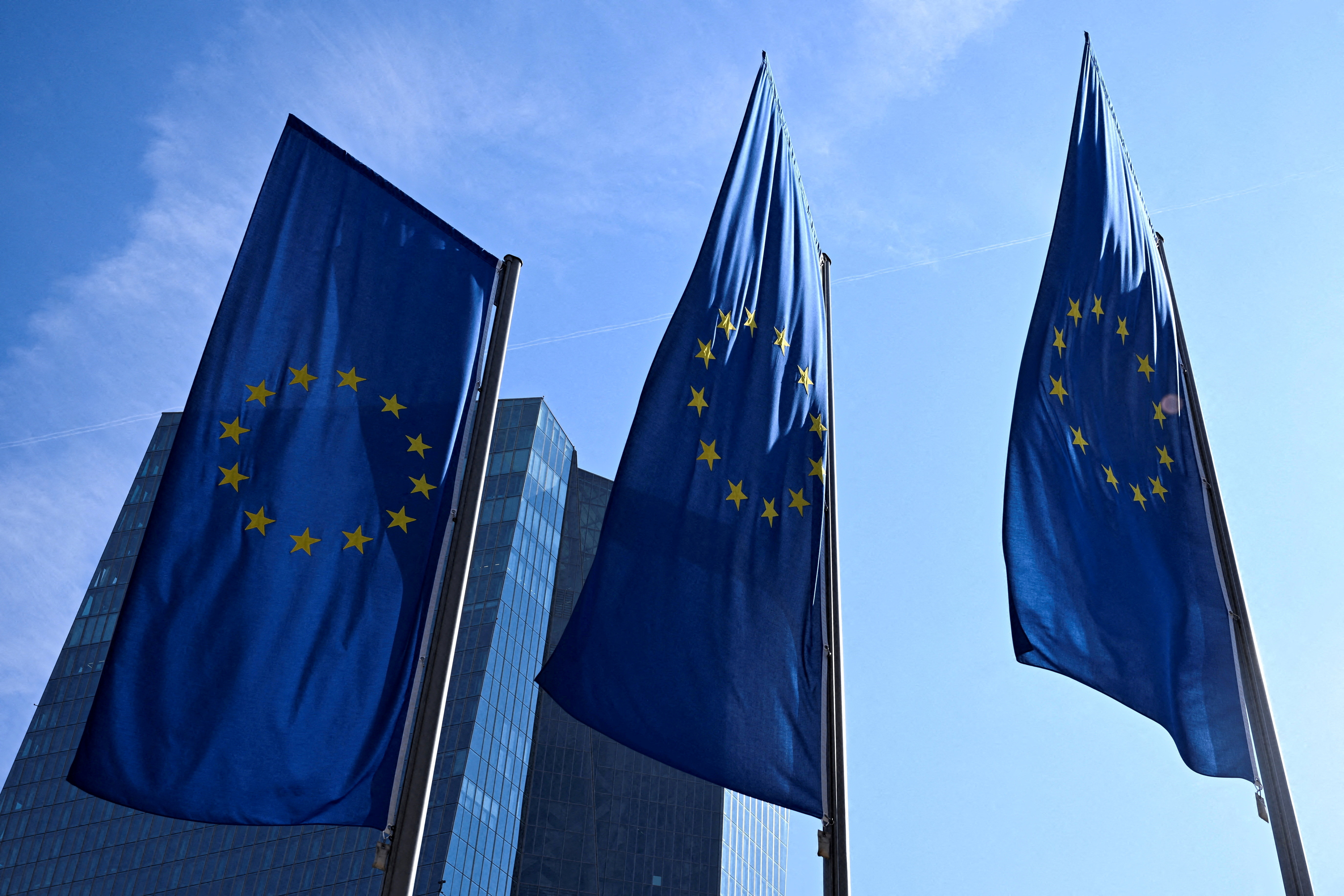 FILE PHOTO: FILE PHOTO: European Union flags flutter outside the European Central Bank (ECB) headquarters in Frankfurt, Germany, March 19, 2026. REUTERS/Jana Rodenbusch/File Photo