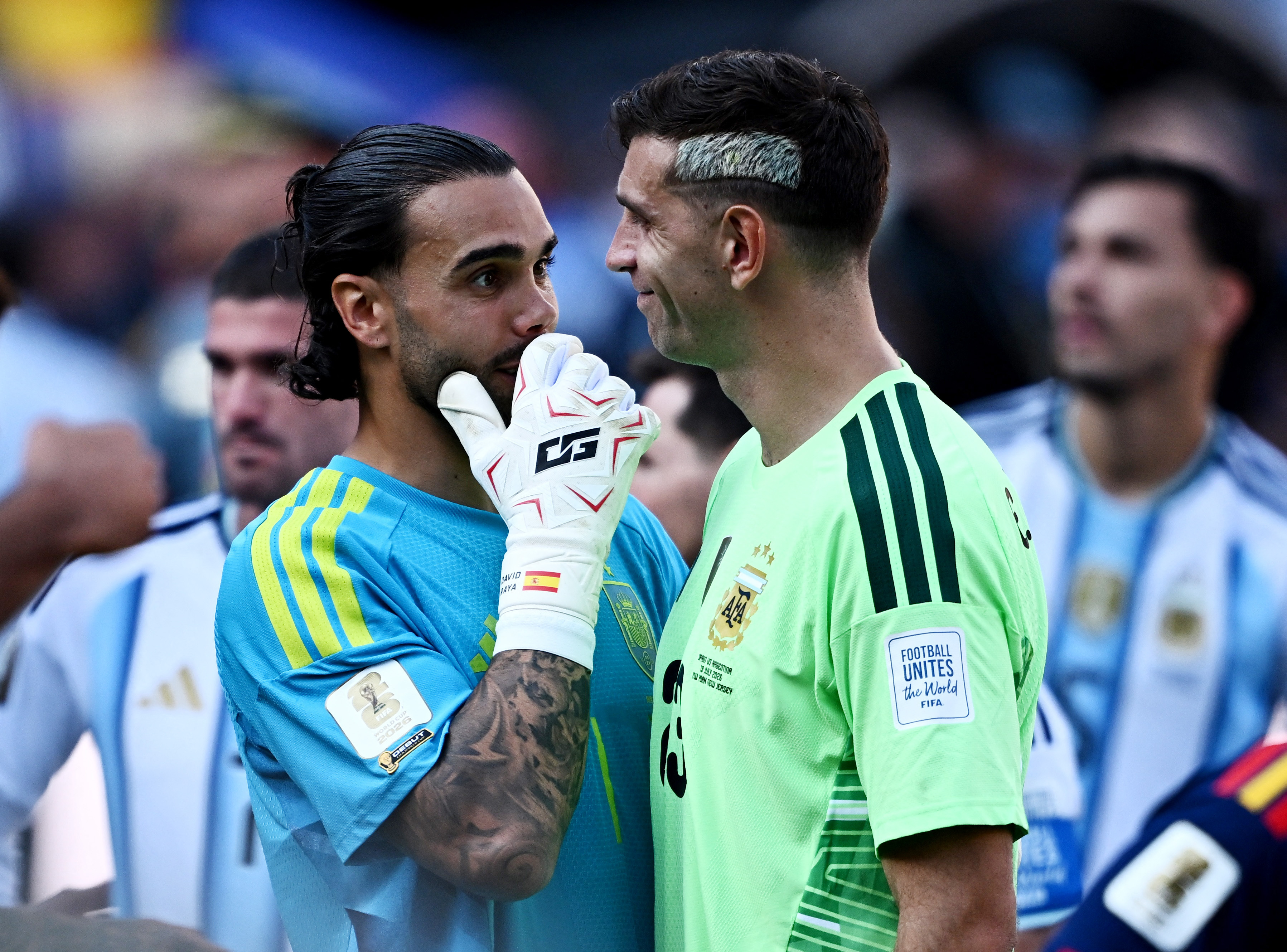 Soccer Football - FIFA World Cup 2026 - Final - Spain v Argentina - New York/New Jersey Stadium, East Rutherford, New Jersey, U.S. - July 19, 2026 Spain's David Raya reacts with Argentina's Emiliano Martinez after the match as Spain win the World Cup REUT