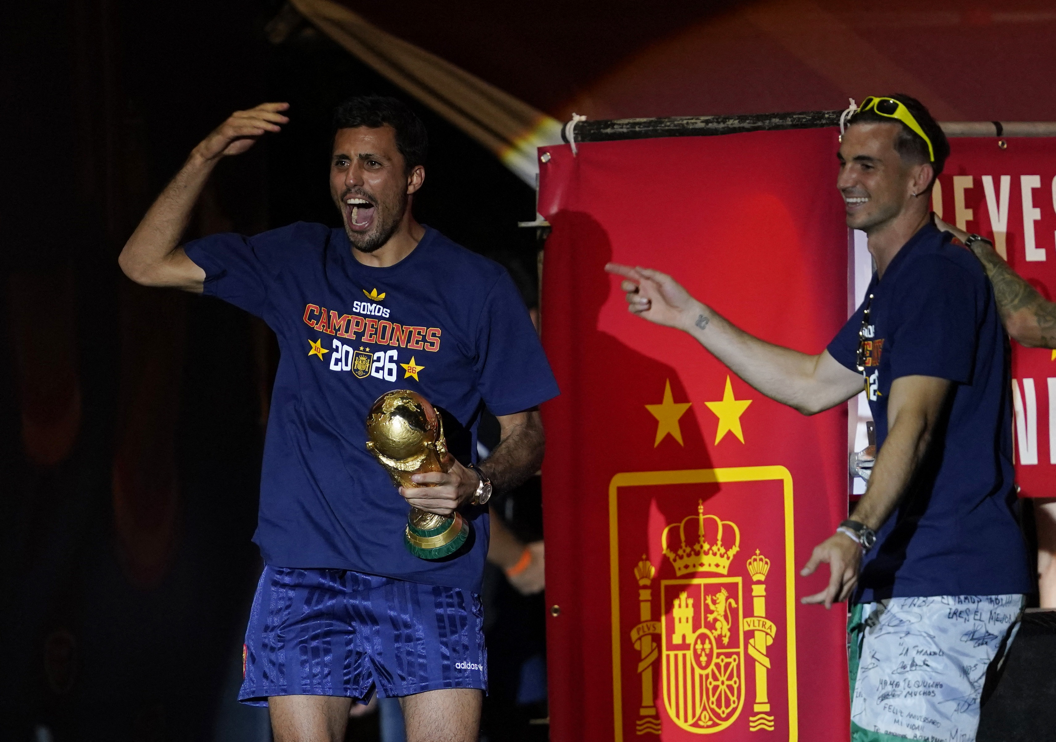 Soccer Football - FIFA World Cup 2026 - Spain Victory Parade - Madrid, Spain - July 20, 2026 Spain's Rodri celebrates with the World Cup trophy on the stage at Cibeles Square in Madrid after the victory parade as fans gather to celebrate winning the World