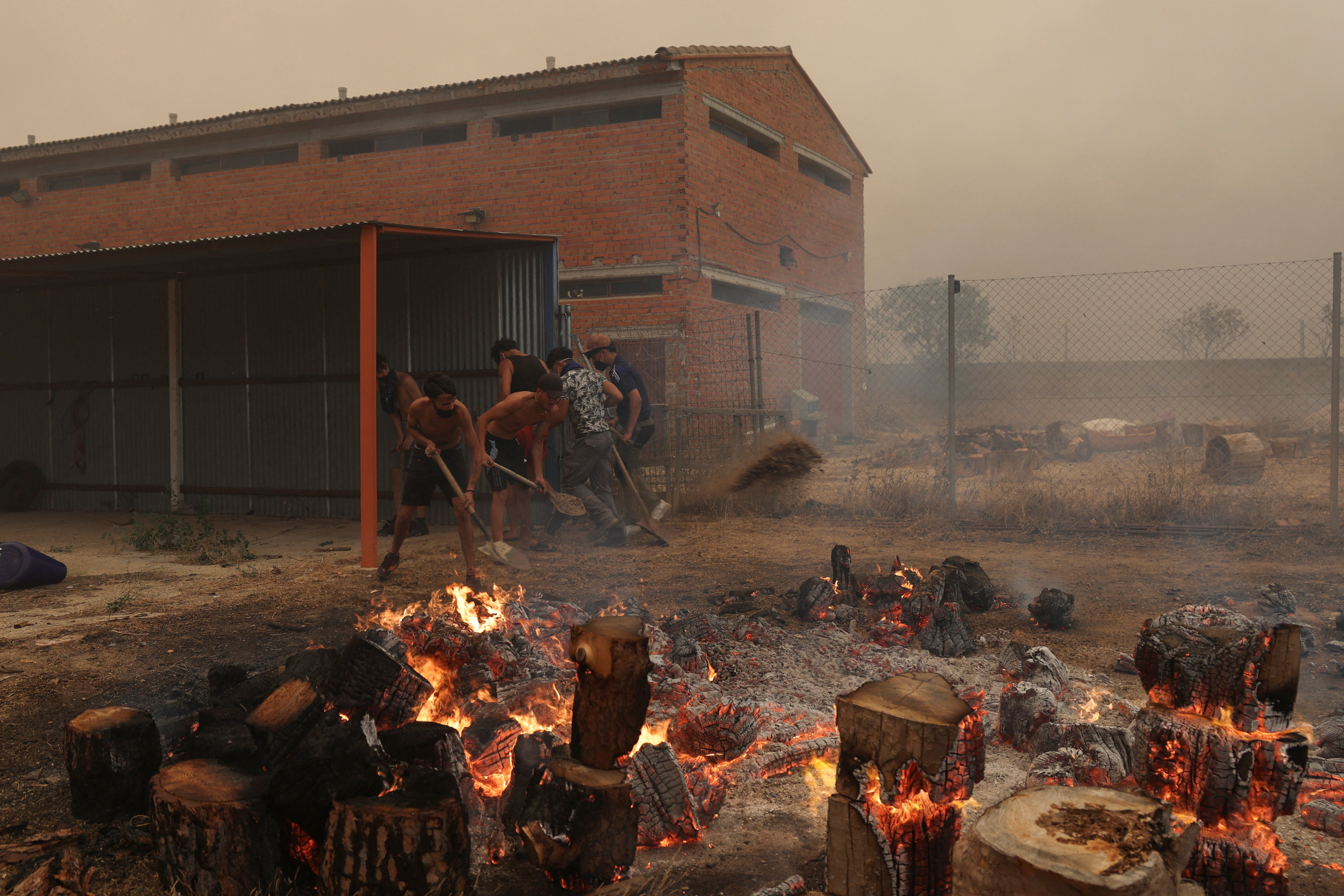 Fire burning though timber around the academy, in the village of El Tiemblo, during wildfires affecting Castilla y Leon province, Spain