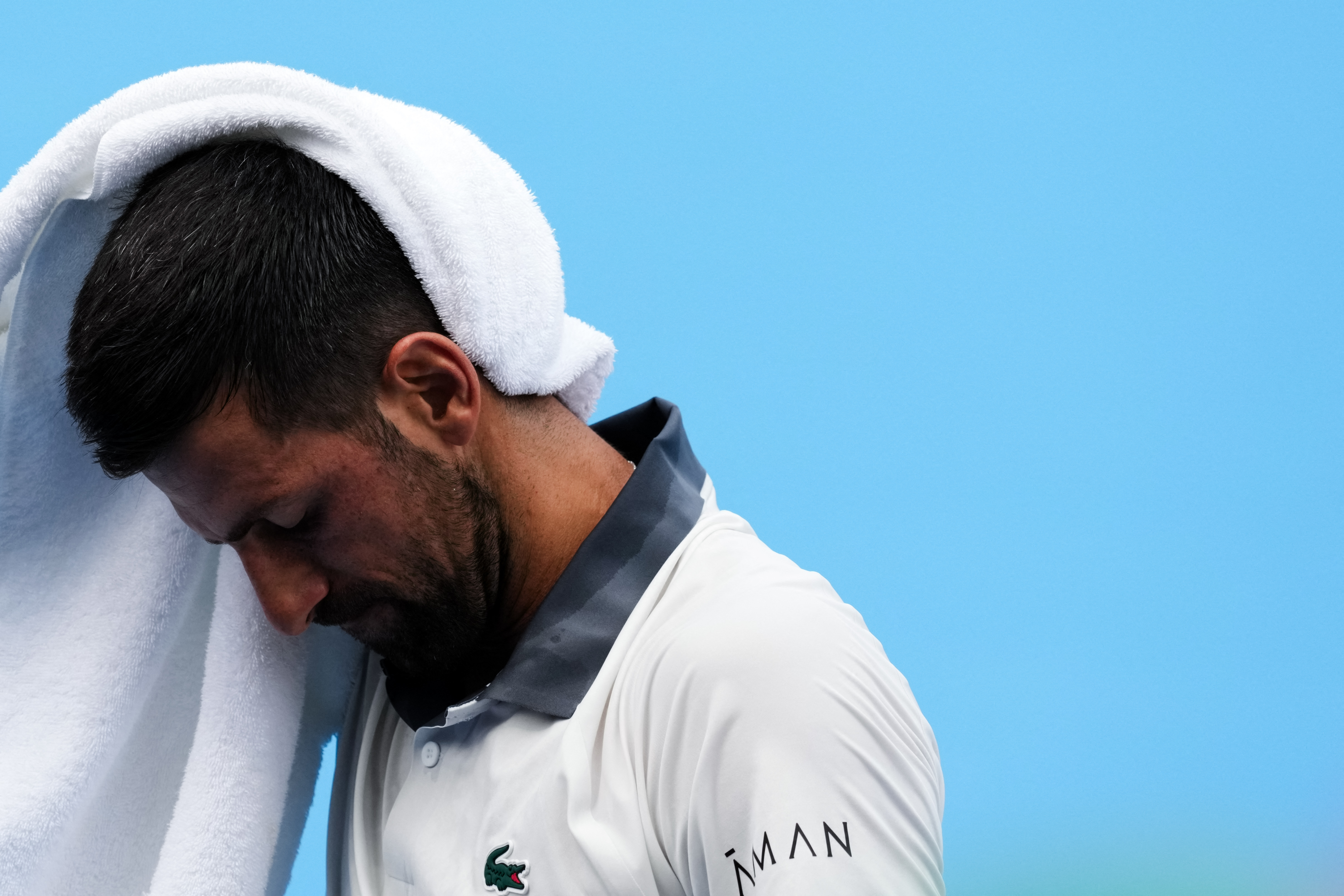 Aug 15, 2026; Mason, OH, USA;  Novak Djokovic (SRB) wipes his head after a point