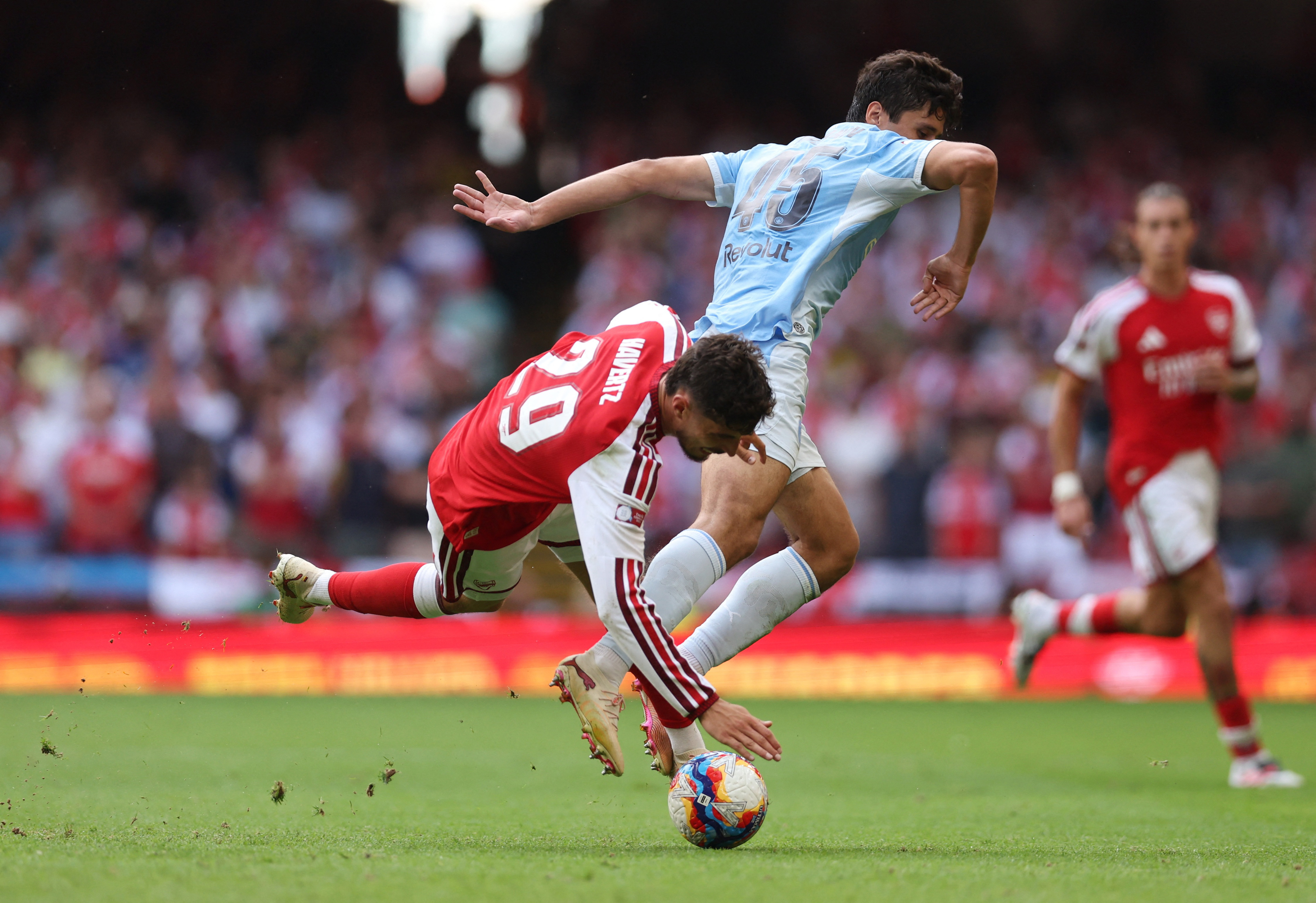 Soccer Football - FA Community Shield - Arsenal v Manchester City - Principality Stadium, Cardiff, Wales, Britain - August 16, 2026 Arsenal's Kai Havertz in action with Manchester City's Abdukodir Khusanov REUTERS/Chris Radburn