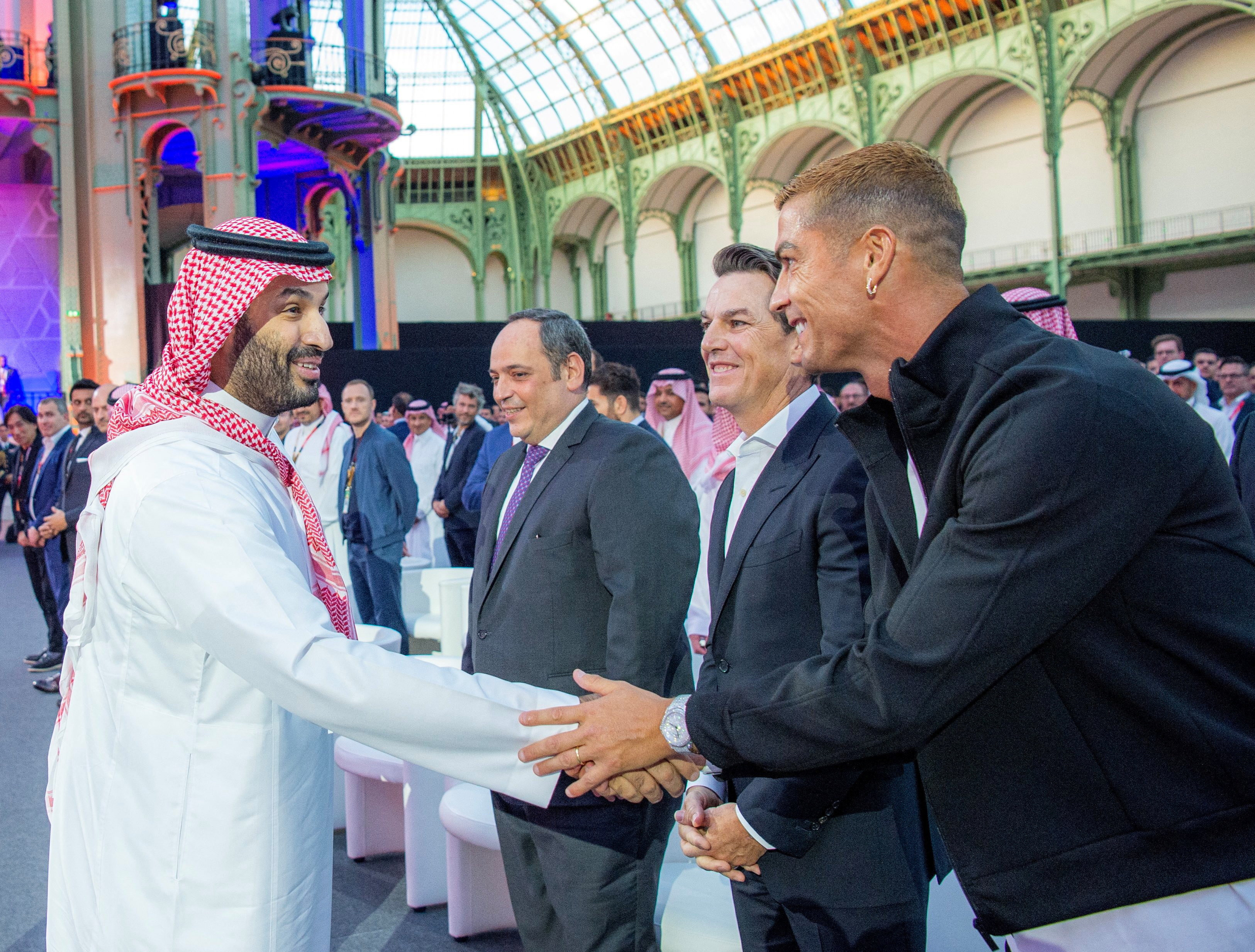 Saudi Crown Prince Mohammed bin Salman meets Portuguese soccer player, Cristiano Ronaldo, as he attends the closing ceremony of the Esports World Cup at the Grand Palais in Paris, France, August 23, 2026. Bandar Algaloud/Courtesy of Saudi Royal Court/Hand