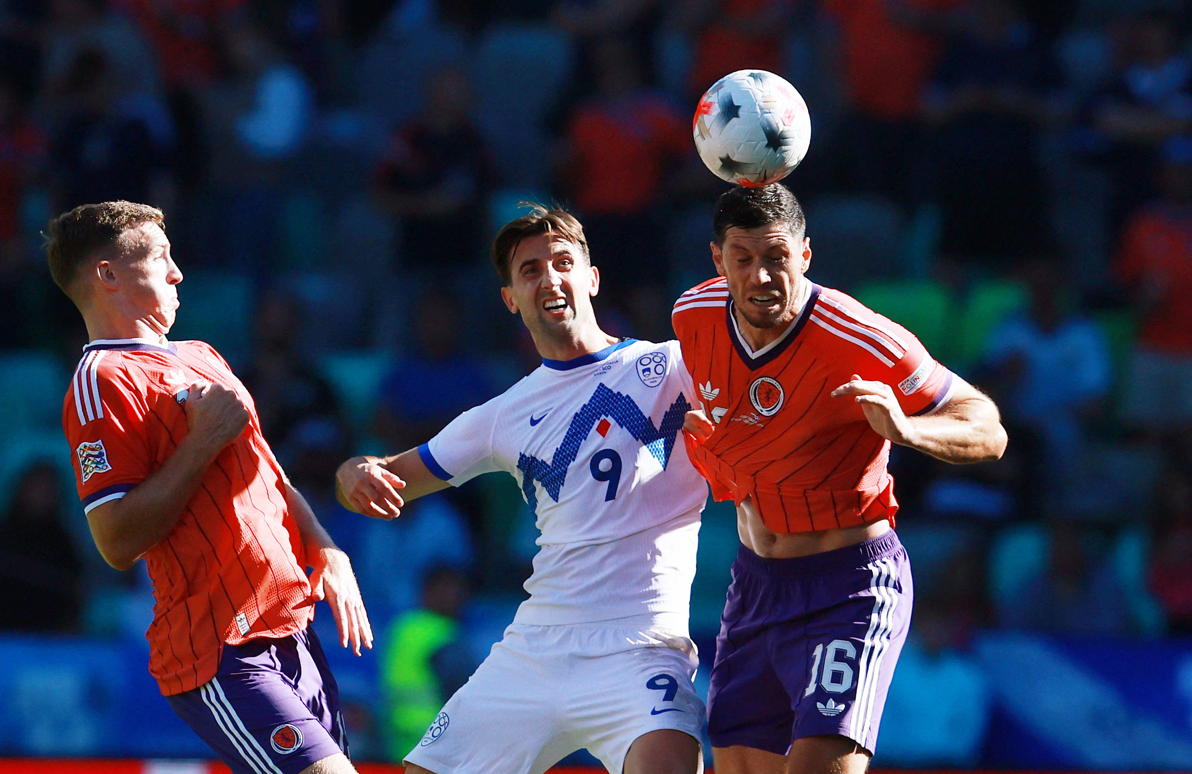 Soccer Football - Nations League - Group B1 - Slovenia v Scotland - Stozice Stadium, Ljubljana, Slovenia - September 26, 2026 Scotland's Scott McKenna in action with Slovenia's Andraz Sporar REUTERS/Borut Zivulovic