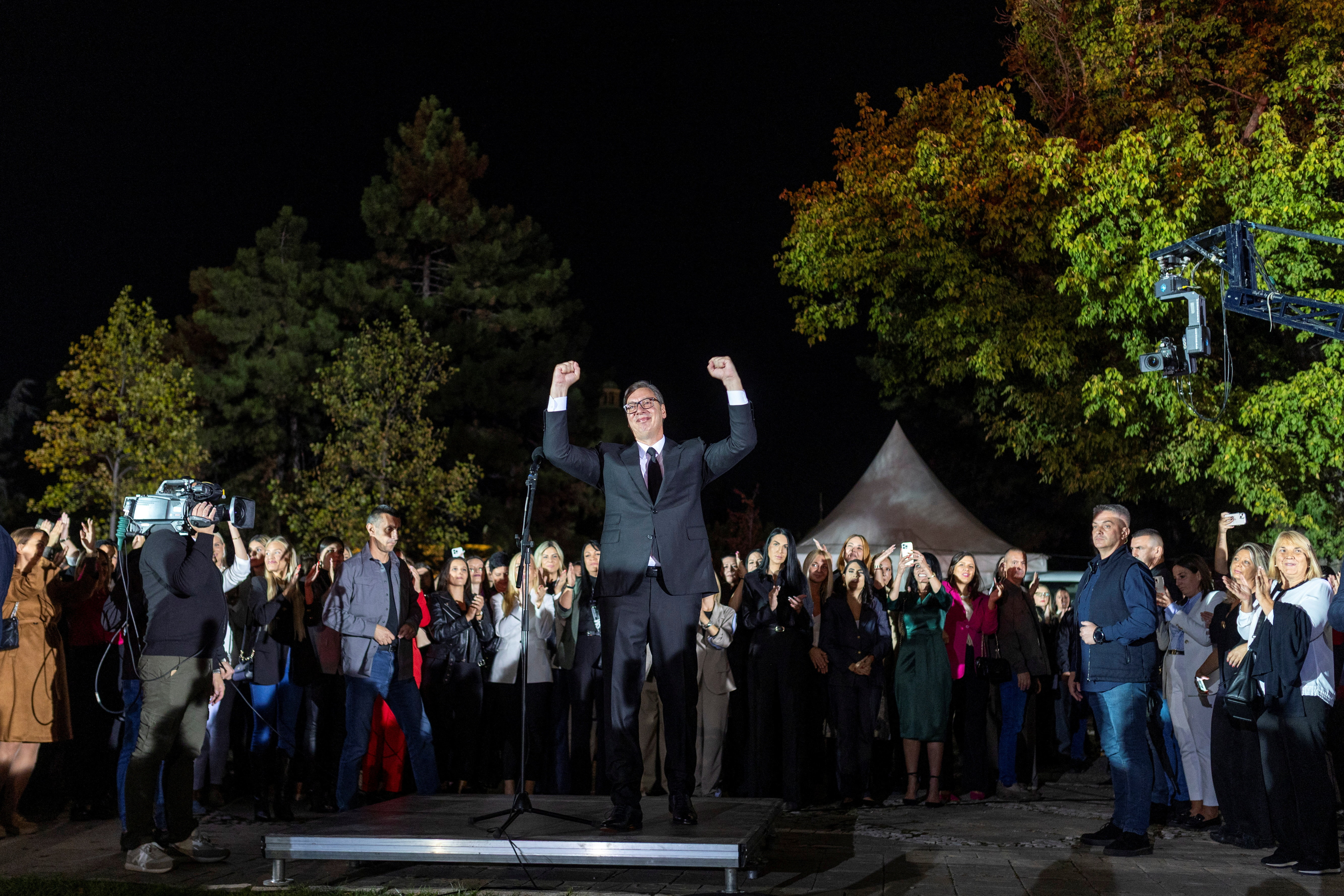 Serbian President Aleksandar Vucic waves to citizens outside the Presidency of Serbia