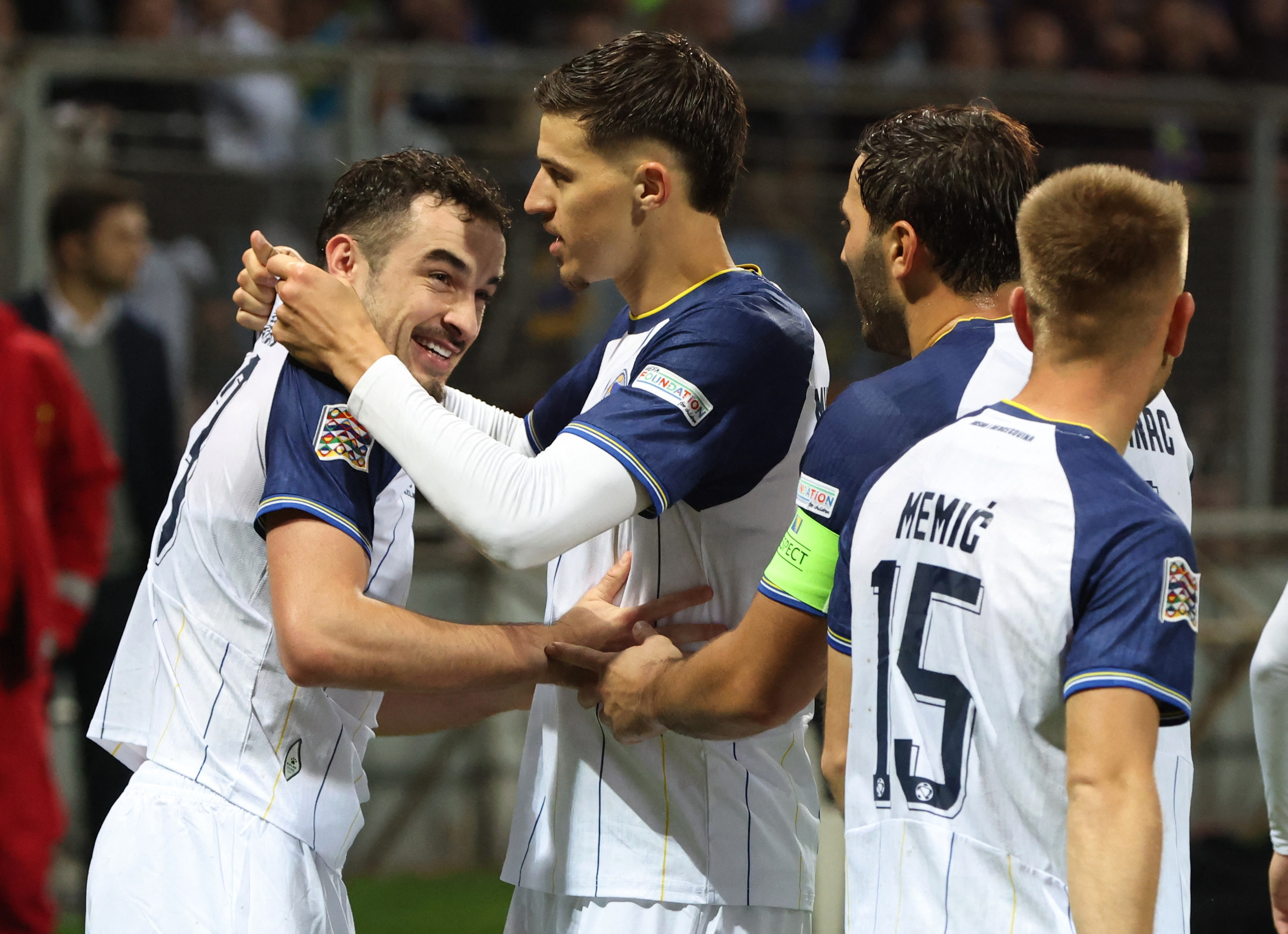 Soccer Football - Nations League - Group B4 - Bosnia and Herzegovina v Poland - Stadion Bilino Polje, Zenica, Bosnia and Herzegovina - October 5, 2026 Bosnia and Herzegovina's Ivan Basic celebrates scoring their first goal with teammates REUTERS/Amel Emri