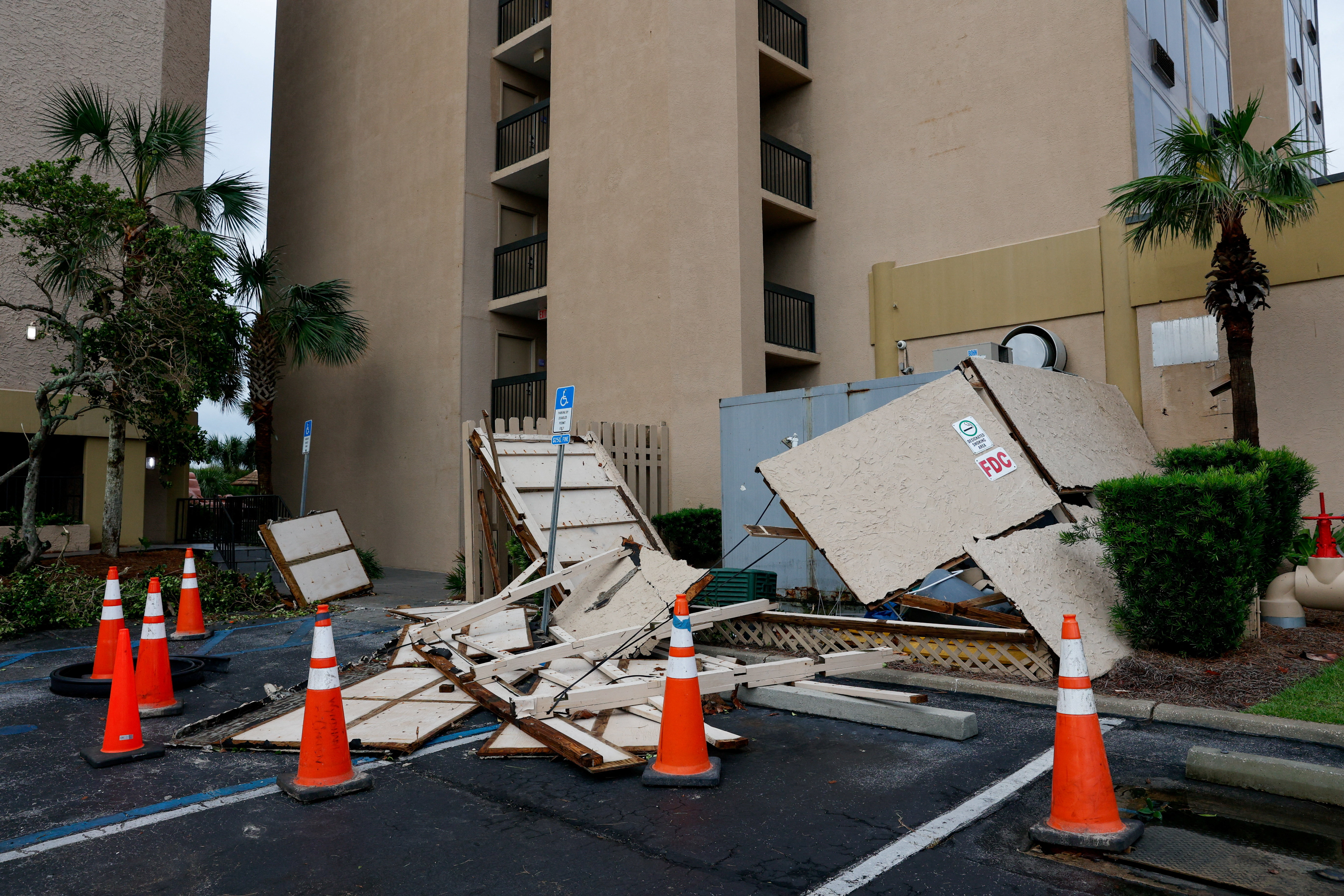 Cones sit near debris in the aftermath of Hurricane Isaias, in Destin, Florida, US, October 10, 2026. REUTERS/Marco Bello