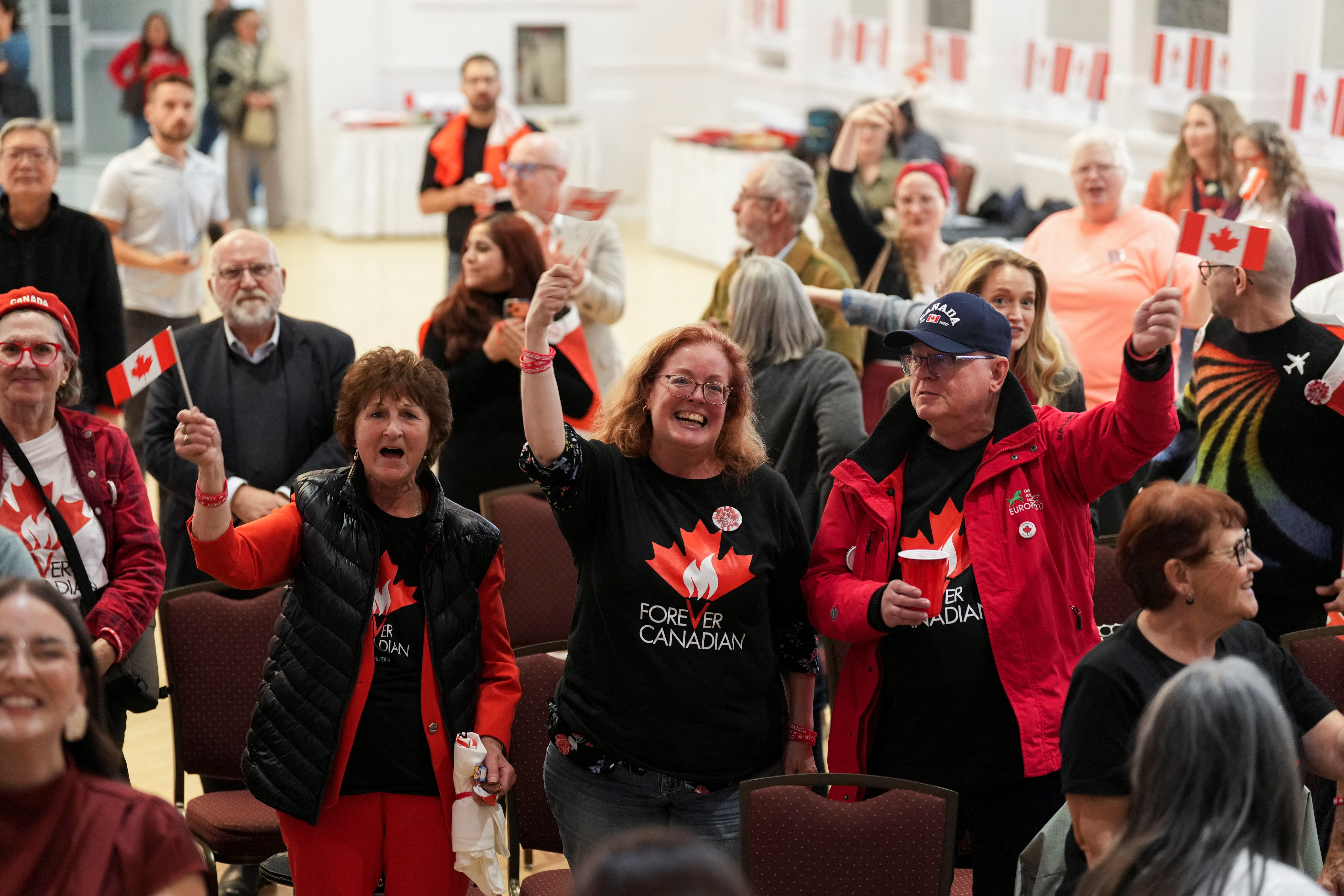 Supporters of the Forever Canadian group, who want Alberta to remain in Canada, react on the day of a non-binding referendum on Alberta sovereignty in Edmonton, Alberta, Canada October 19, 2026. REUTERS/Todd Korol