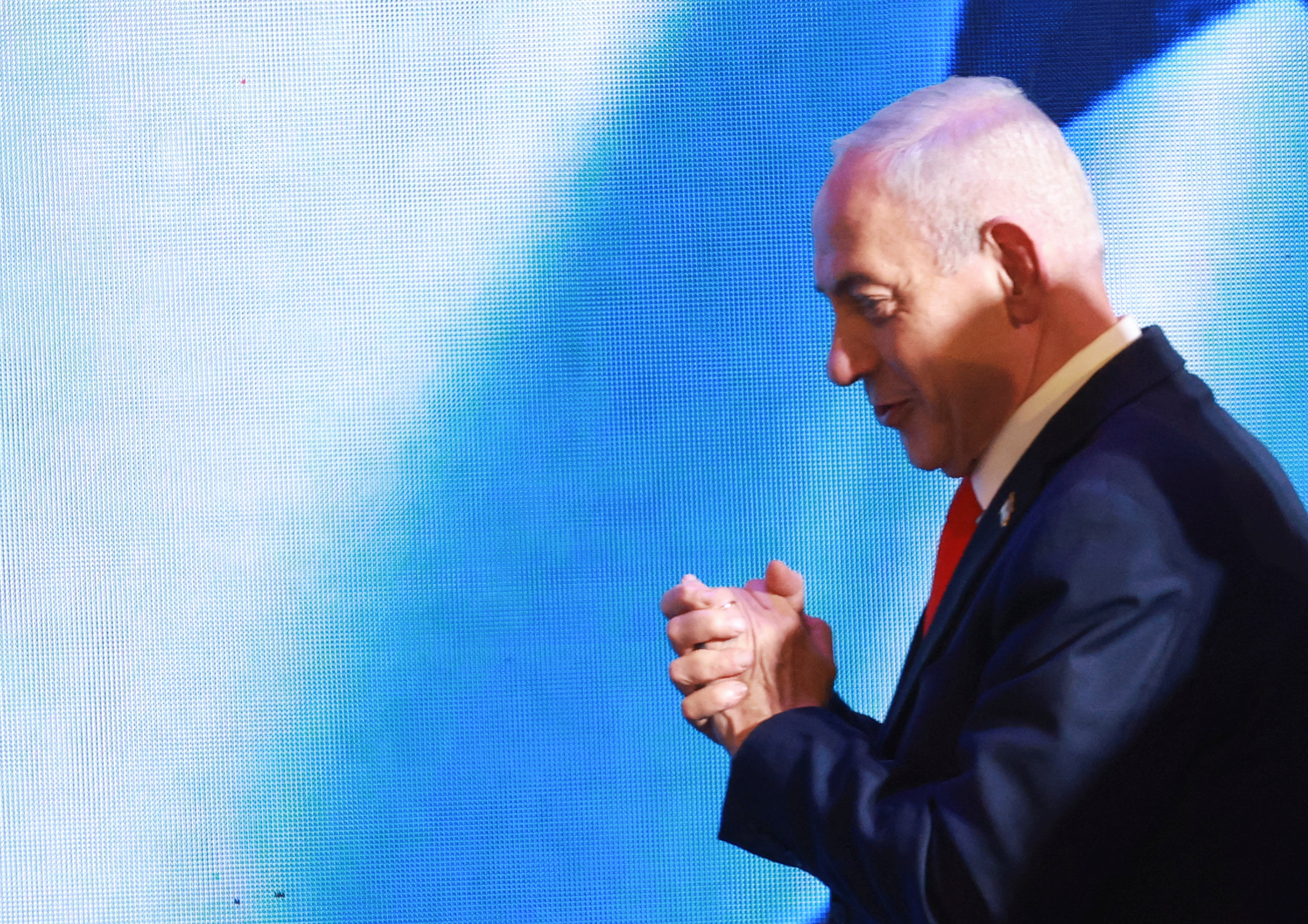 Israeli Prime Minister and Likud party leader Benjamin Netanyahu gestures as he walks on the stage ahead of speaking after exit polls, at his party headquarters during Israel's national election, in Jerusalem, October 28, 2026. REUTERS/Ronen Zvulun