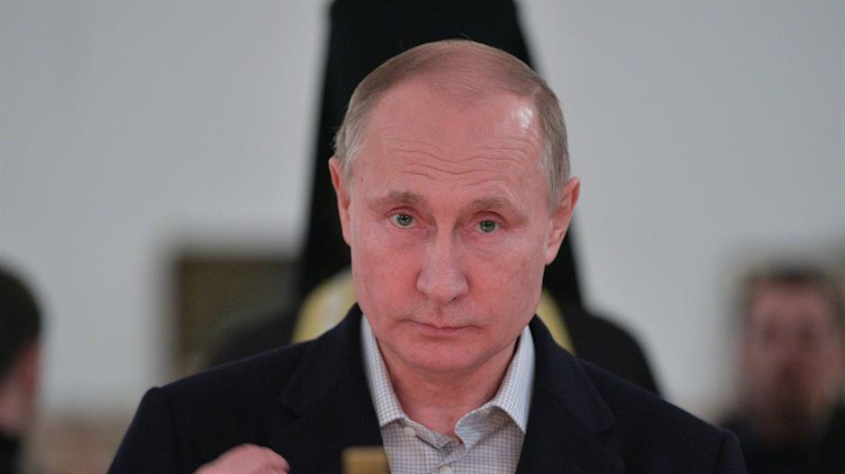 2018-01-19T040936Z_756135442_RC111D100600_RTRMADP_3_RELIGION-EPIPHANY-PUTIN