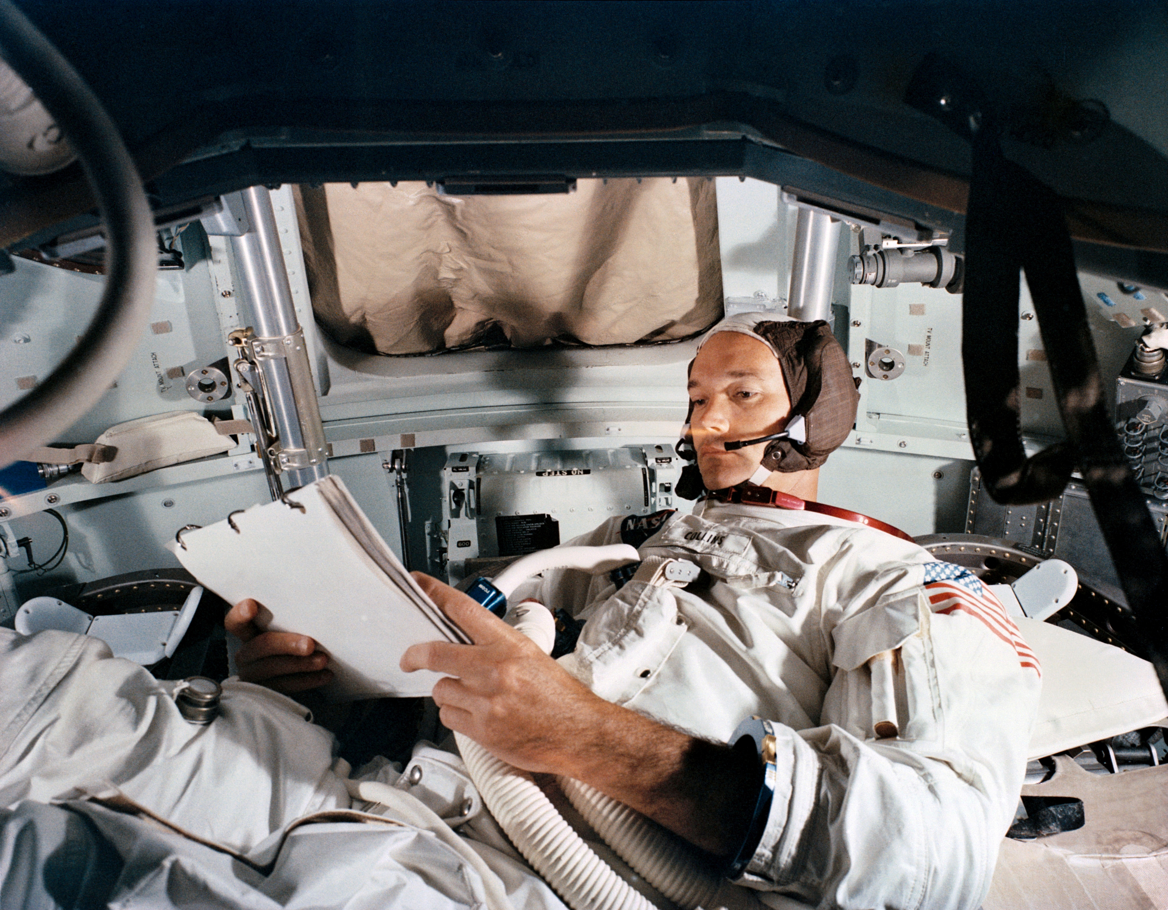 FILE PHOTO: Command Module pilot Michael Collins practices in the CM simulator at Kennedy Space Cente