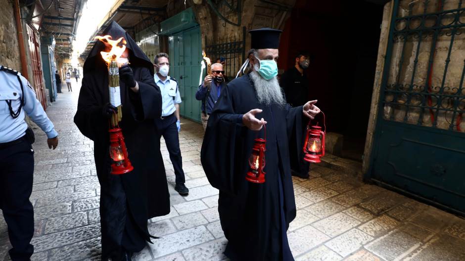 2020-04-18t125059z-1494624457-rc207g98cslc-rtrmadp-3-health-coronavirus-orthodox-holy-fire-jerusalem-289950.jpeg
