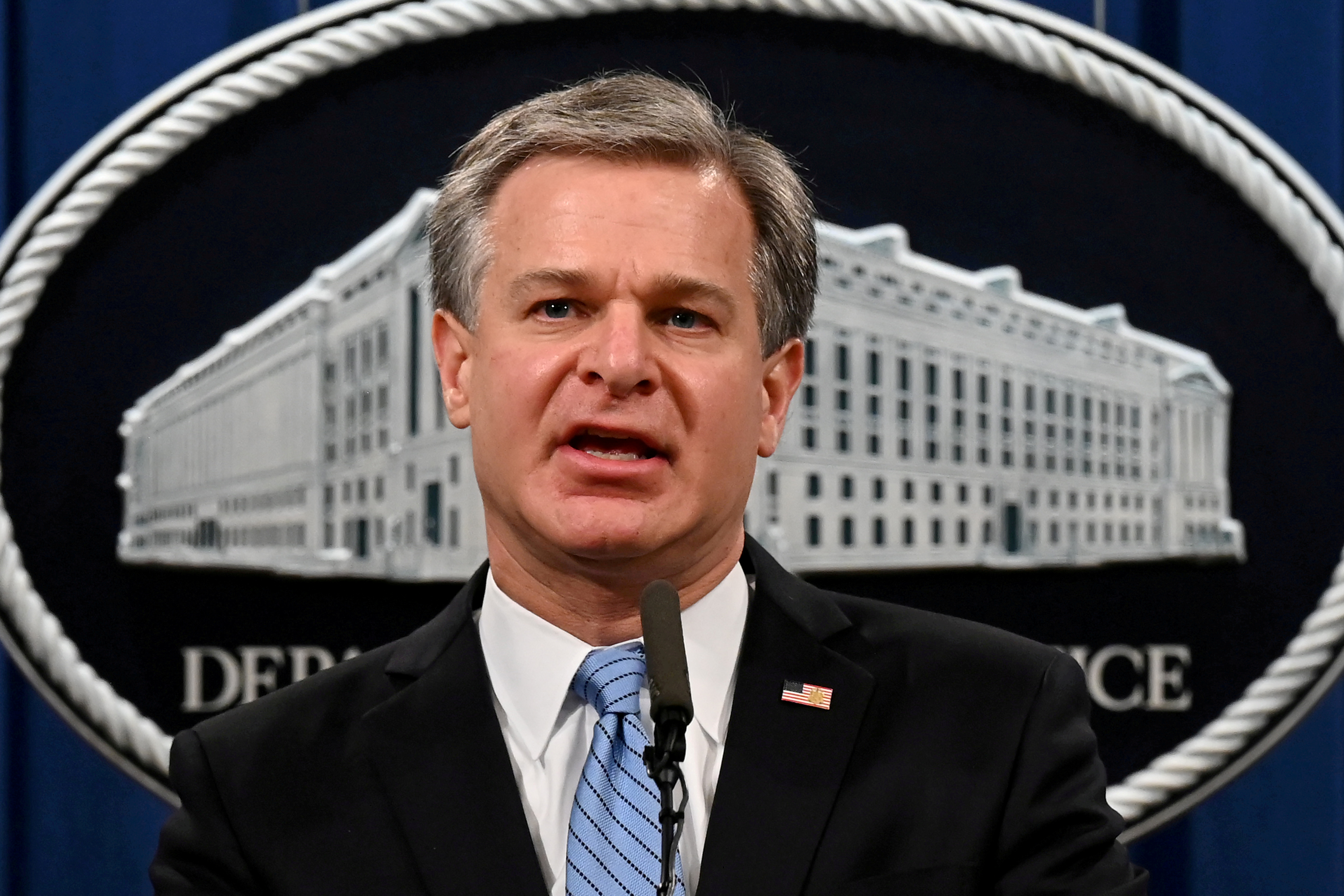 FILE PHOTO: FBI Director Christopher Wray speaks during a press conference at the Department of Justice in Washington