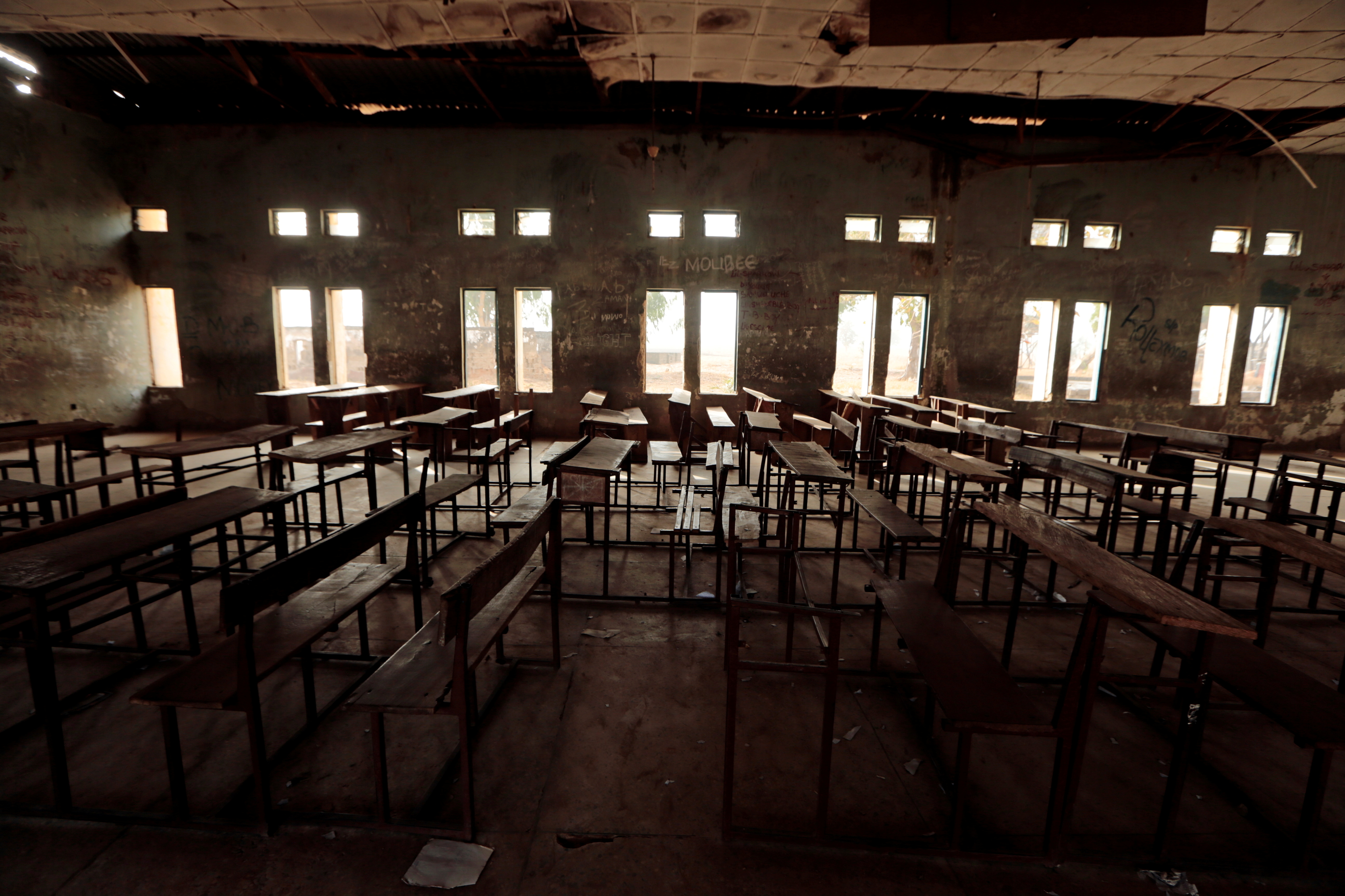 Classroom furniture is seen arranged inside the hall at the Government Science College in Kagara