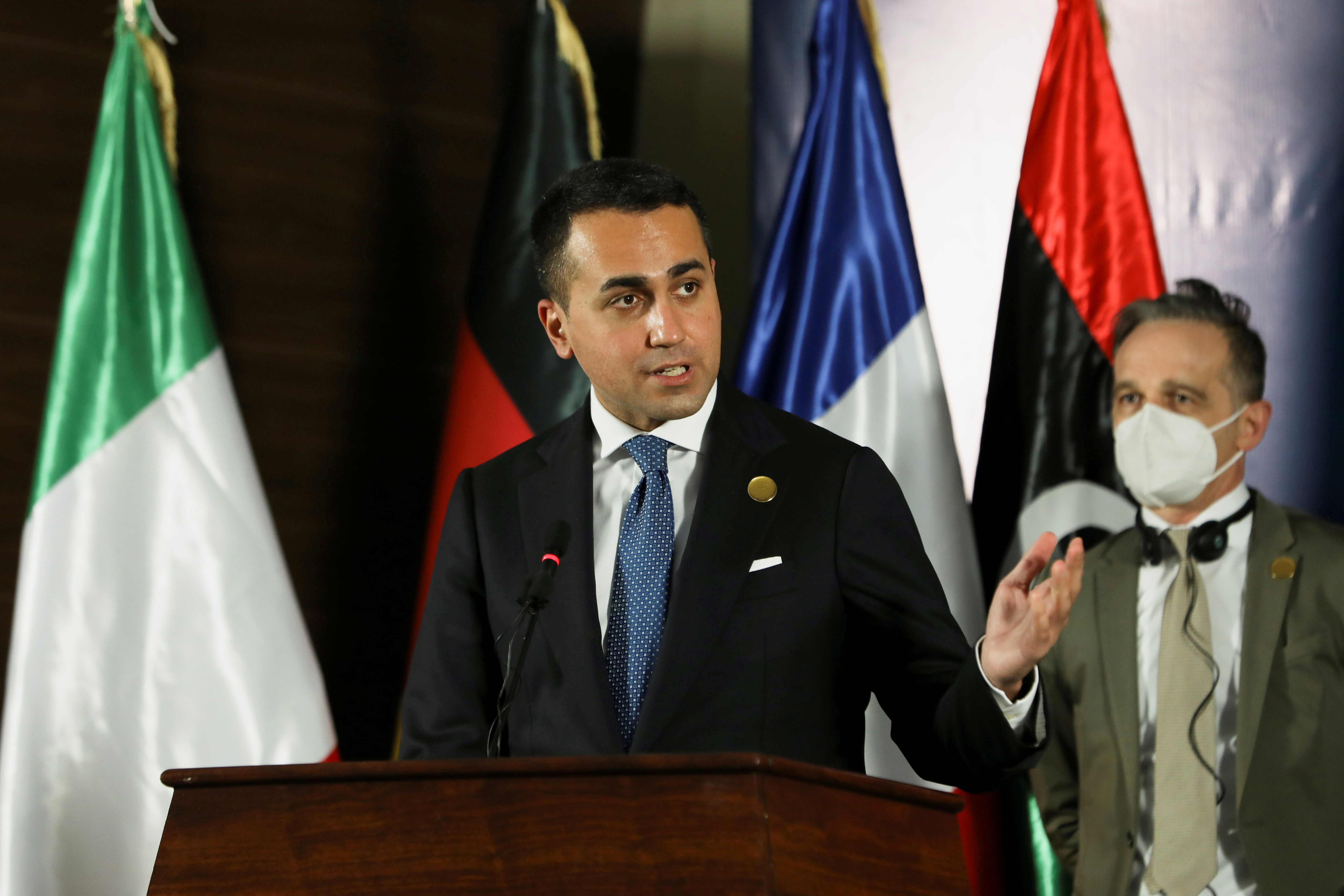 Italian Foreign Minister Luigi Di Maio sepals as he delivers a joint statement with French Foreign Minister Jean-Yves Le Drian, German Foreign Minister Heiko Maas and Libyan Foreign Minister Najla el-Mangoush, in Tripoli