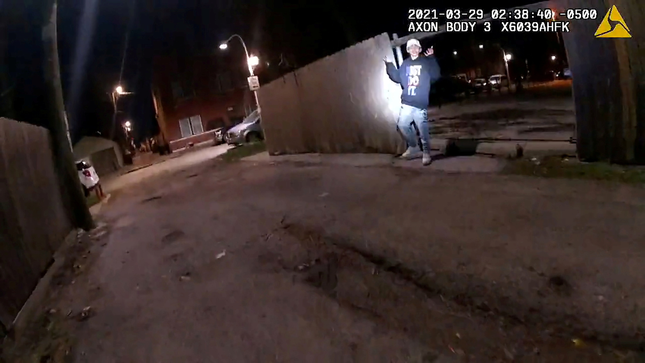 Adam Toledo, 13, holds up his hands a split second before he was shot by police