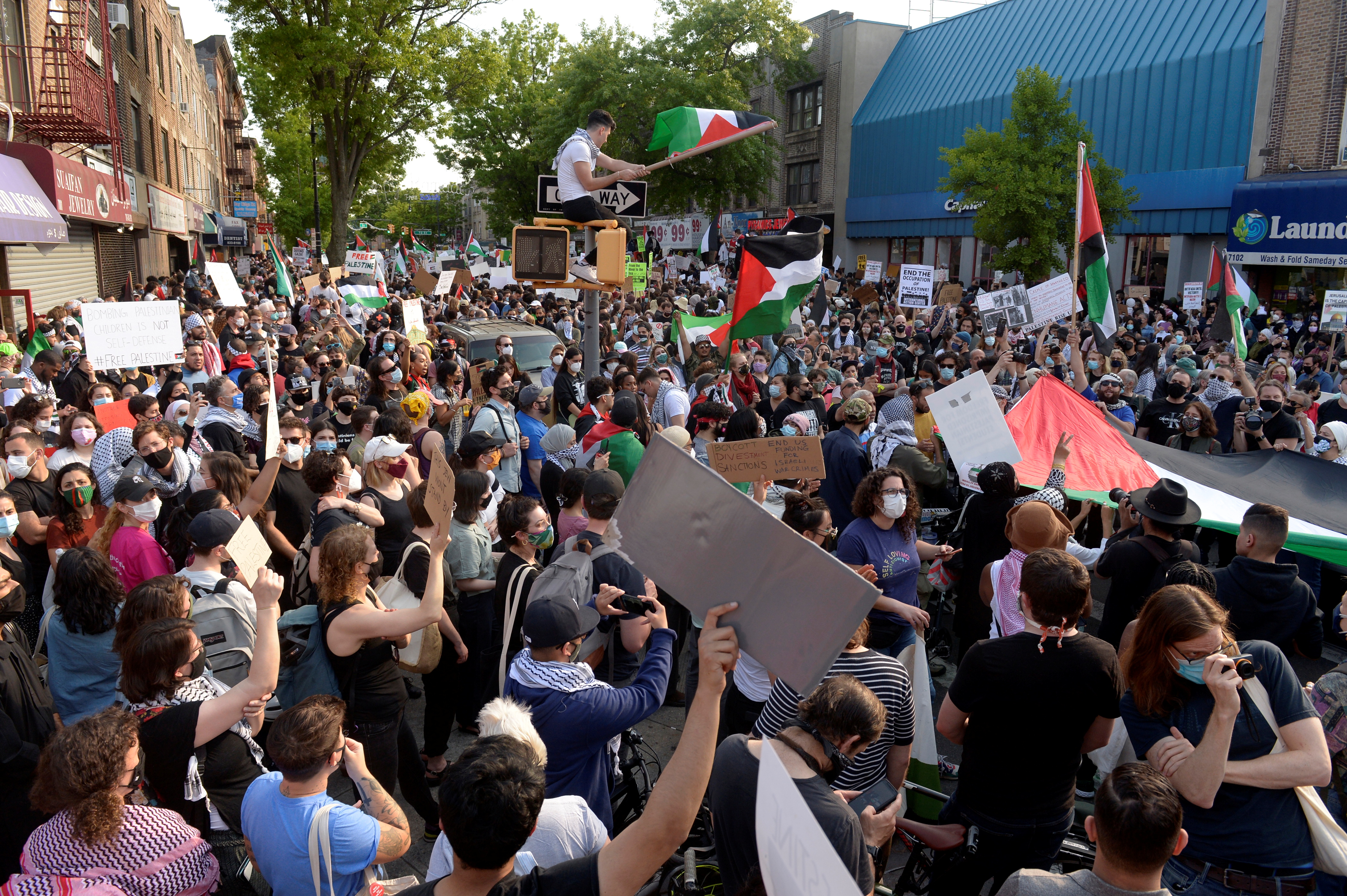 Palestinians and pro-Palestinian supporters protest against Israeli attacks on Gaza amid days of conflict between the two sides