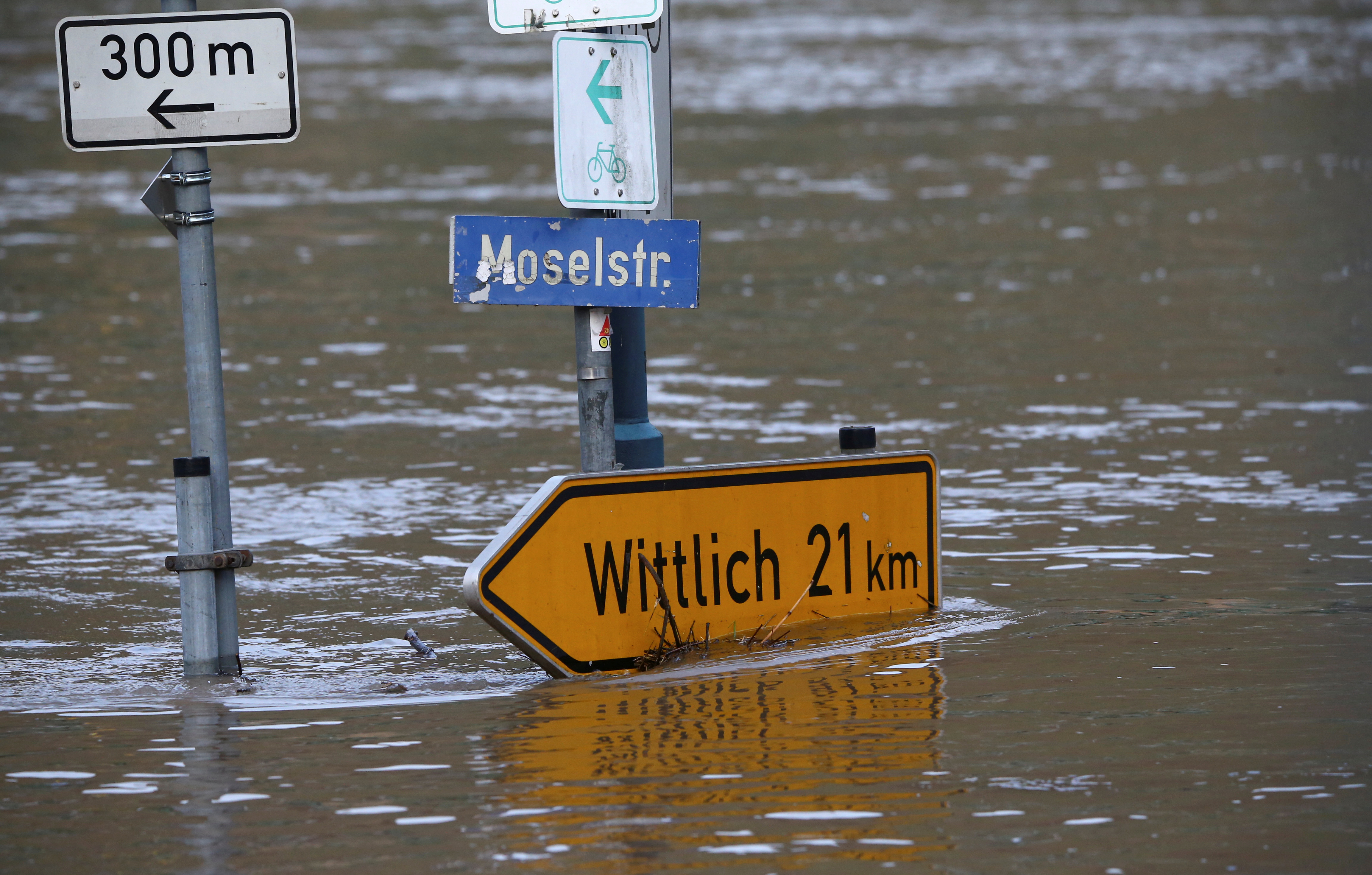FILE PHOTO: Moselle street is flooded by the river Moselle in Reil, Germany