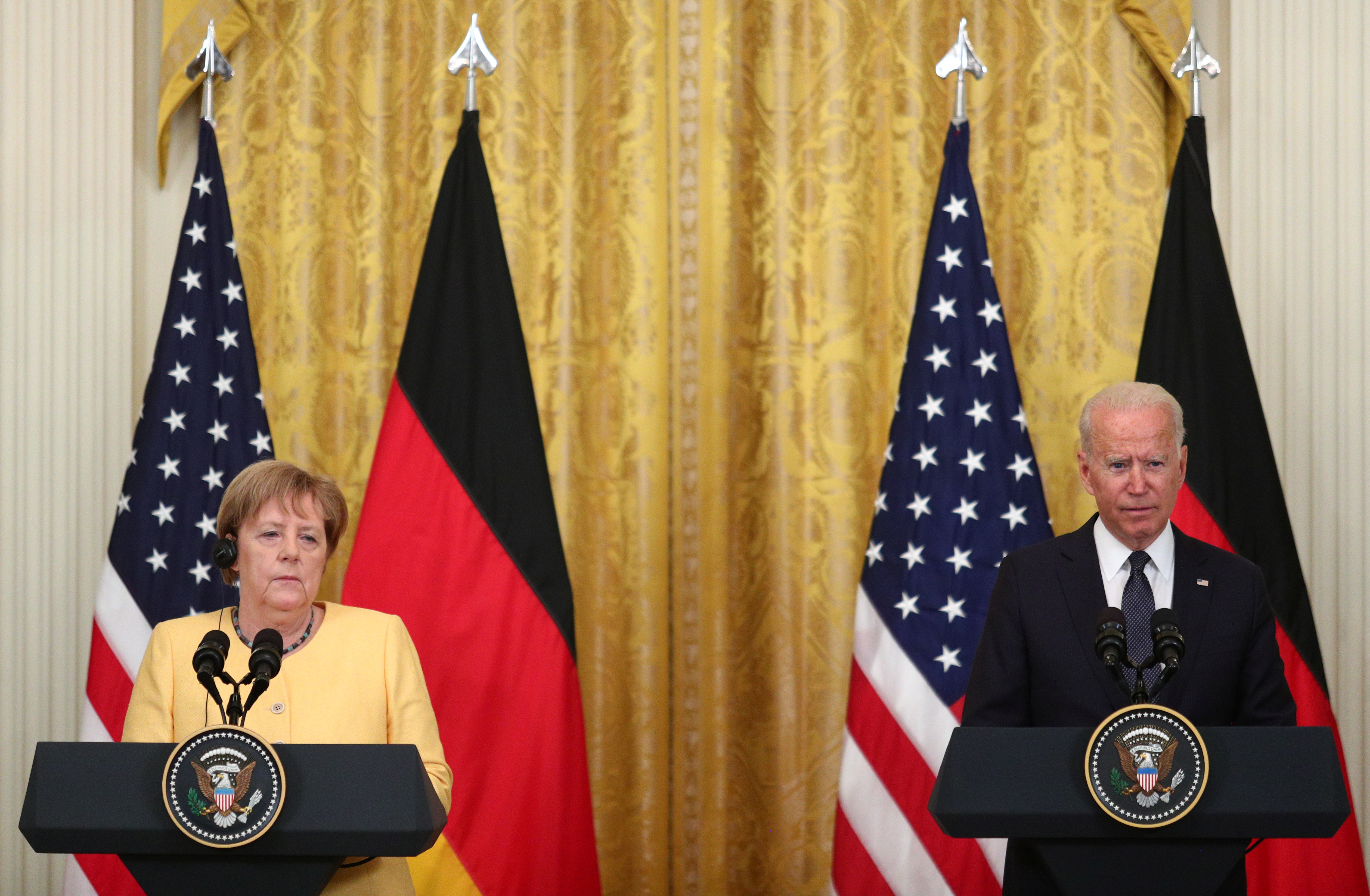 U.S. President Joe Biden and German Chancellor Angela Merkel attend a joint news conference in the East Room at the White House