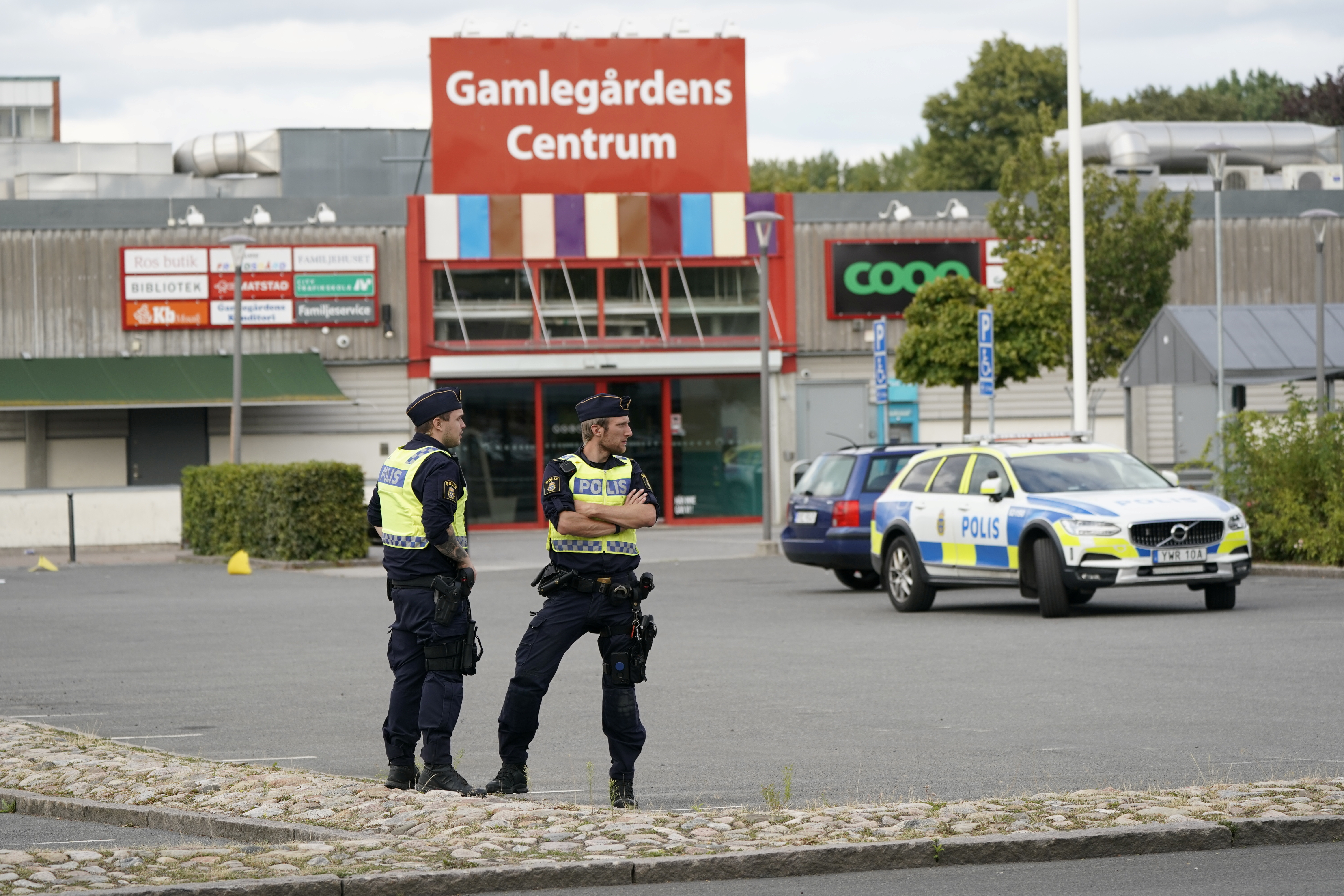 Police officers work at the scene after a shooting in Kristianstad