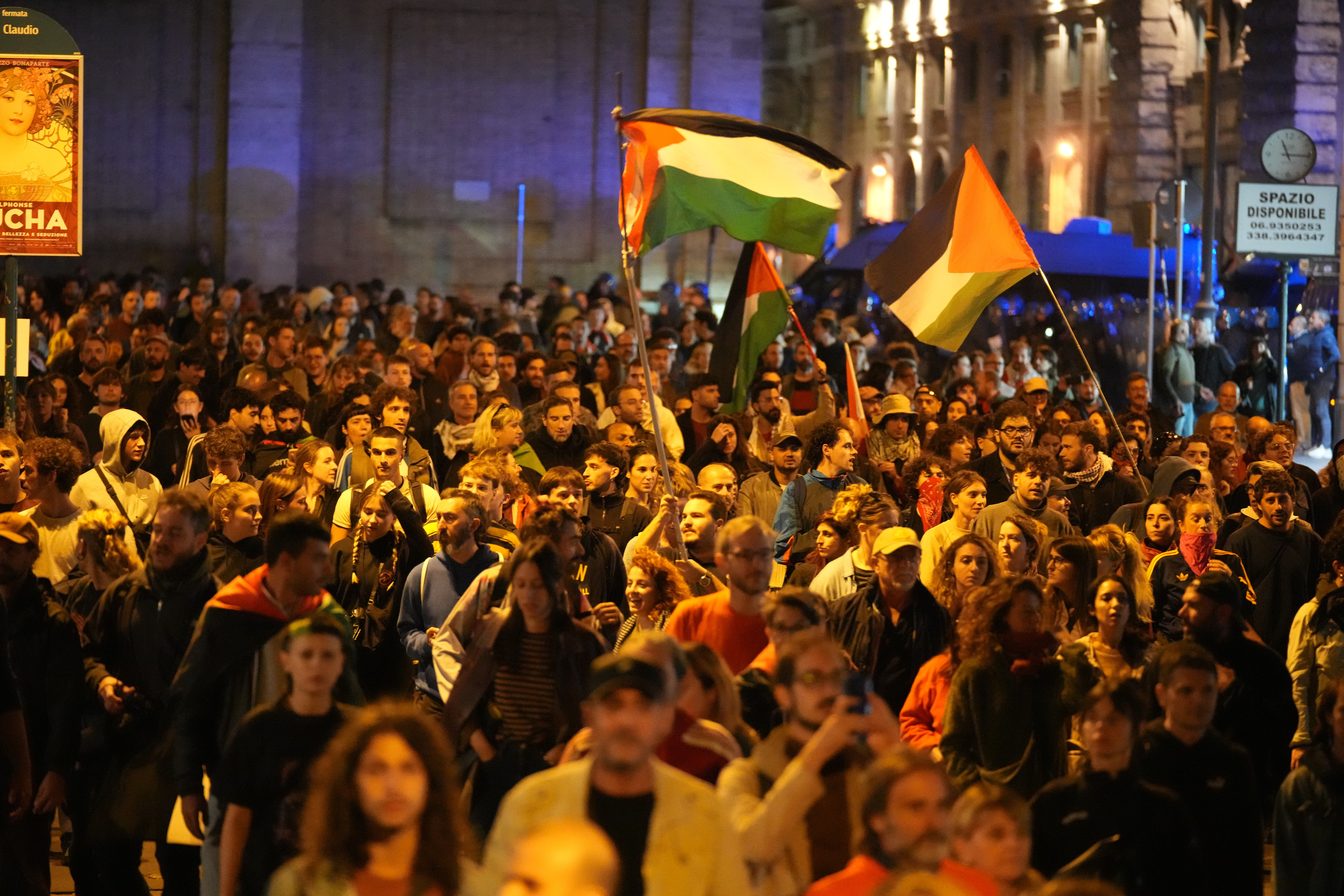 Pro-Palestinian demonstrators take to the streets in downtown Rome late Wednesday, Oct. 1, 2025, after news that a Gaza-bound aid flotilla had been intercepted by Israeli forces in the Mediterranean Sea. (AP Photo/Andrew Medichini)