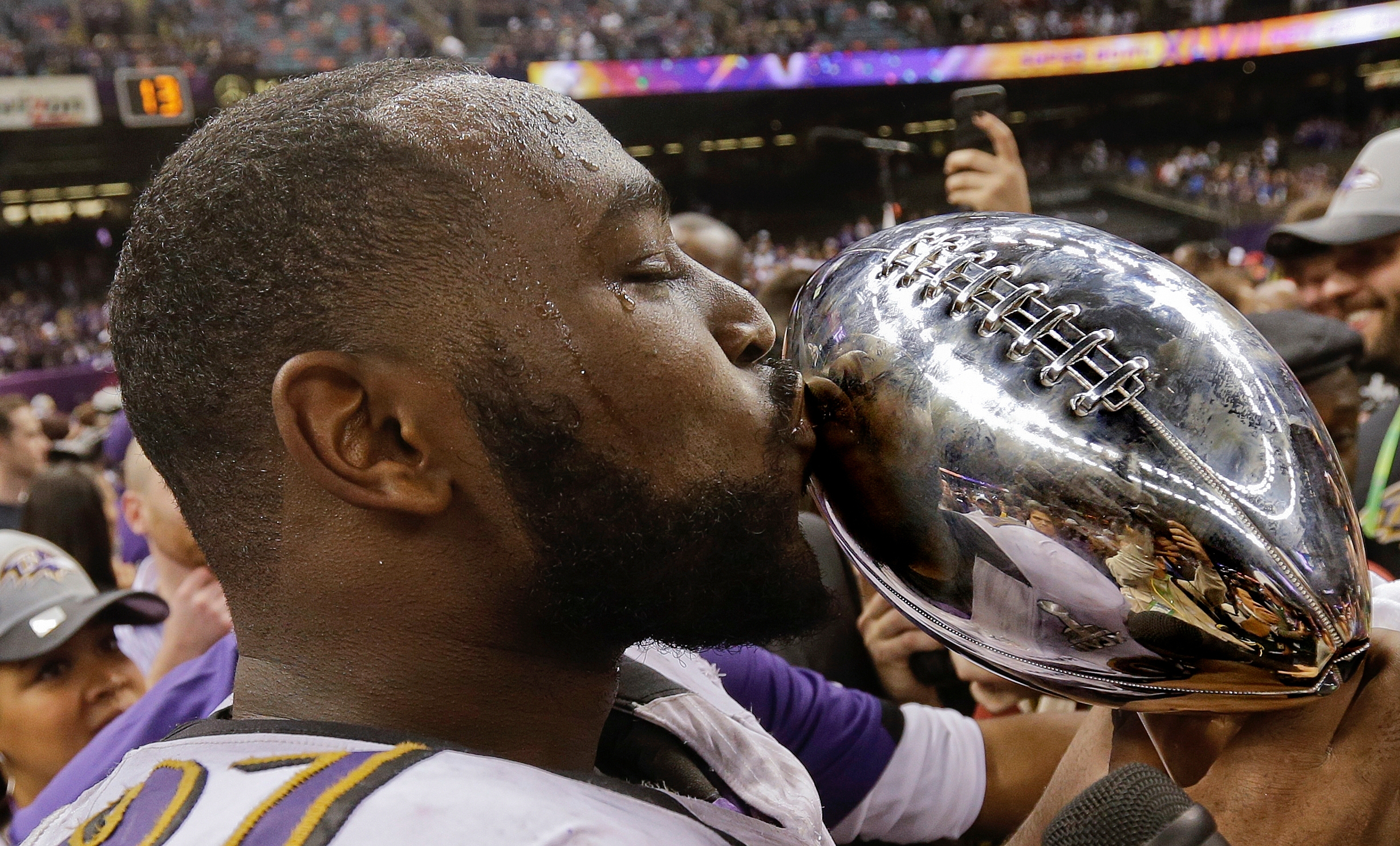 FILE - Baltimore Ravens defensive end Arthur Jones (97) kisses the Vince Lombardi Trophy after defeating the San Francisco 49ers  in the NFL Super Bowl XLVII football game, Sunday, Feb. 3, 2013, in New Orleans. (AP Photo/Dave Martin, File)