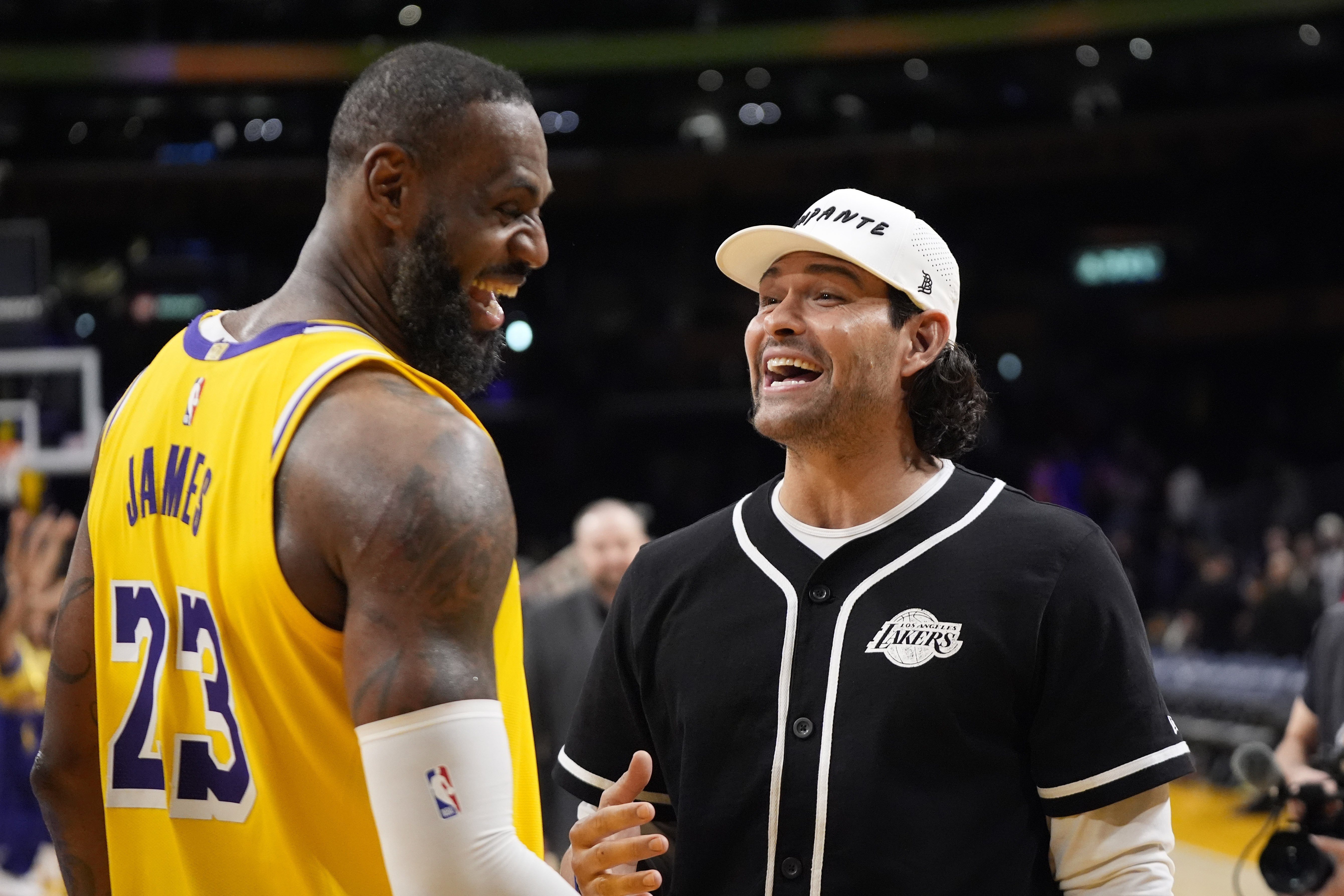 Los Angeles Lakers forward LeBron James, left, talks with former NFL quarterback Mark Sanchez after an NBA basketball game against the Chicago Bulls Thursday, Jan. 25, 2024, in Los Angeles. (AP Photo/Mark J. Terrill)