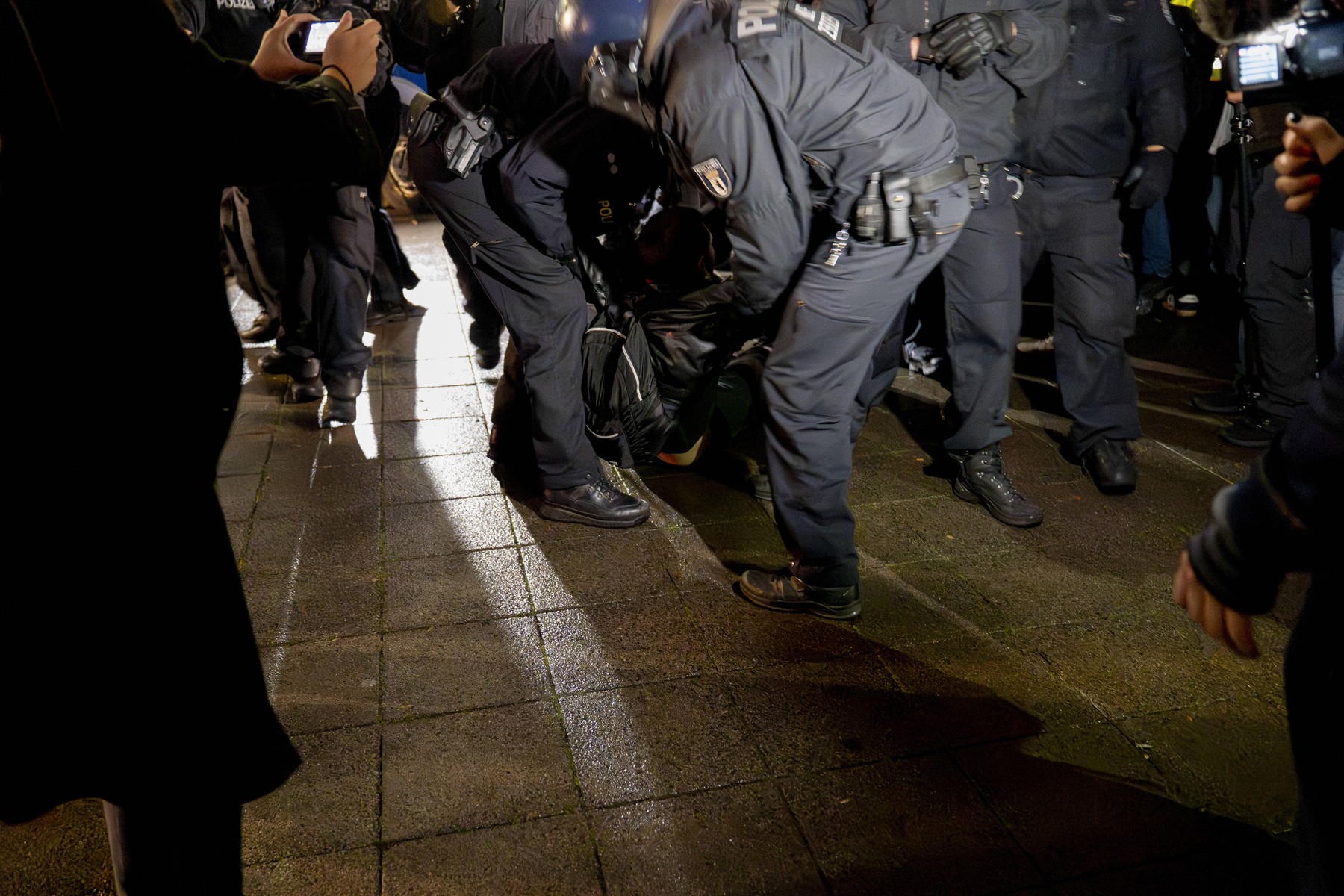 Police officers detain a protester during a pro-Palestinian demonstration