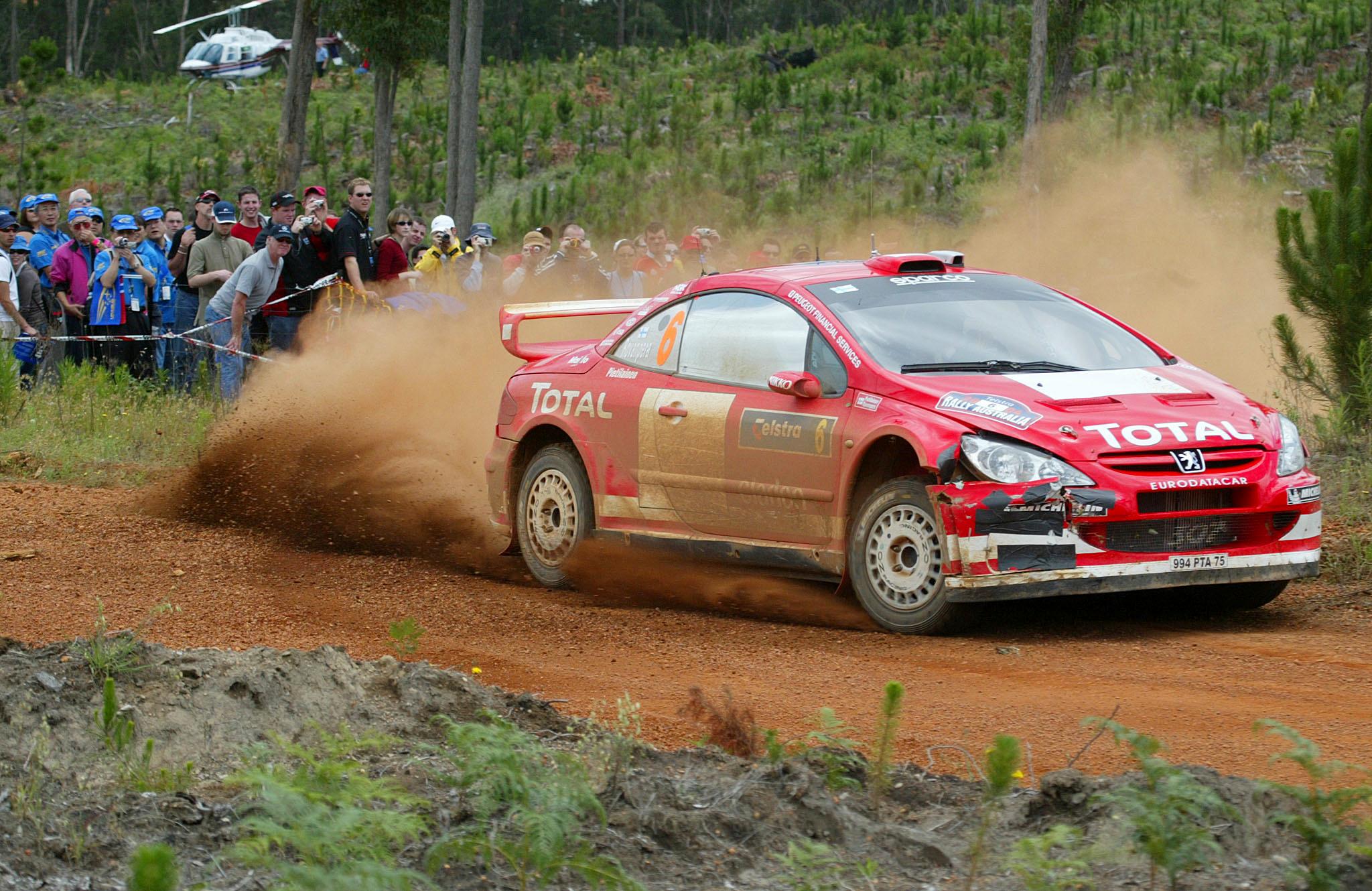 Finland's Harri Rovanpera running fourth competes in the SS5 Dwellingup section of the World Rally Leg One in Perth, 12 November, 2004. The Australian event of the World Rally is the last for the season. AFP PHOTO/Tony ASHBY (Photo by TONY ASHBY / AFP)