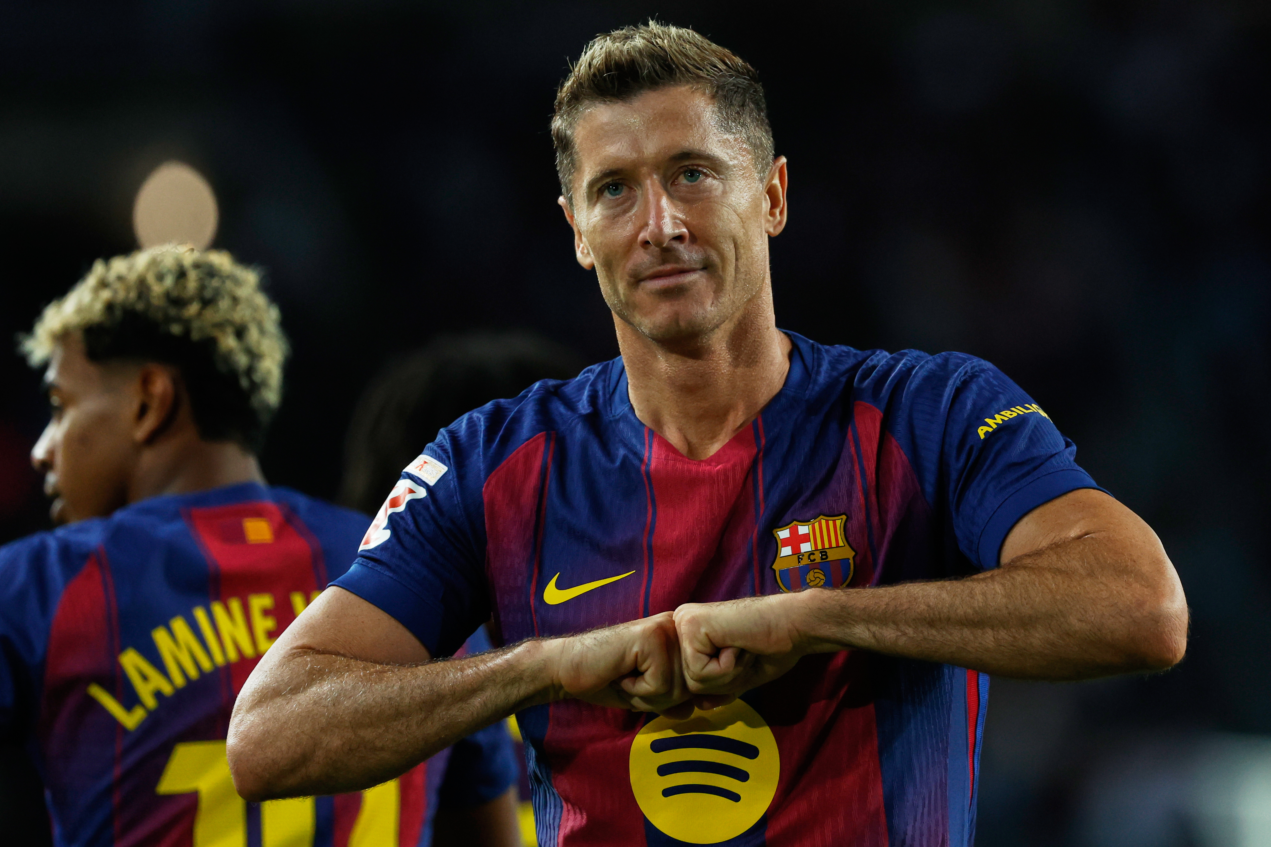 Barcelona's Robert Lewandowski celebrates scoring his side's 2nd goal during a Spanish La Liga soccer match between FC Barcelona and Real Sociedad at the Lluis Companys Olympic Stadium in Barcelona, Spain, Sunday, Sept. 28, 2025. (AP Photo/Joan Monfort)