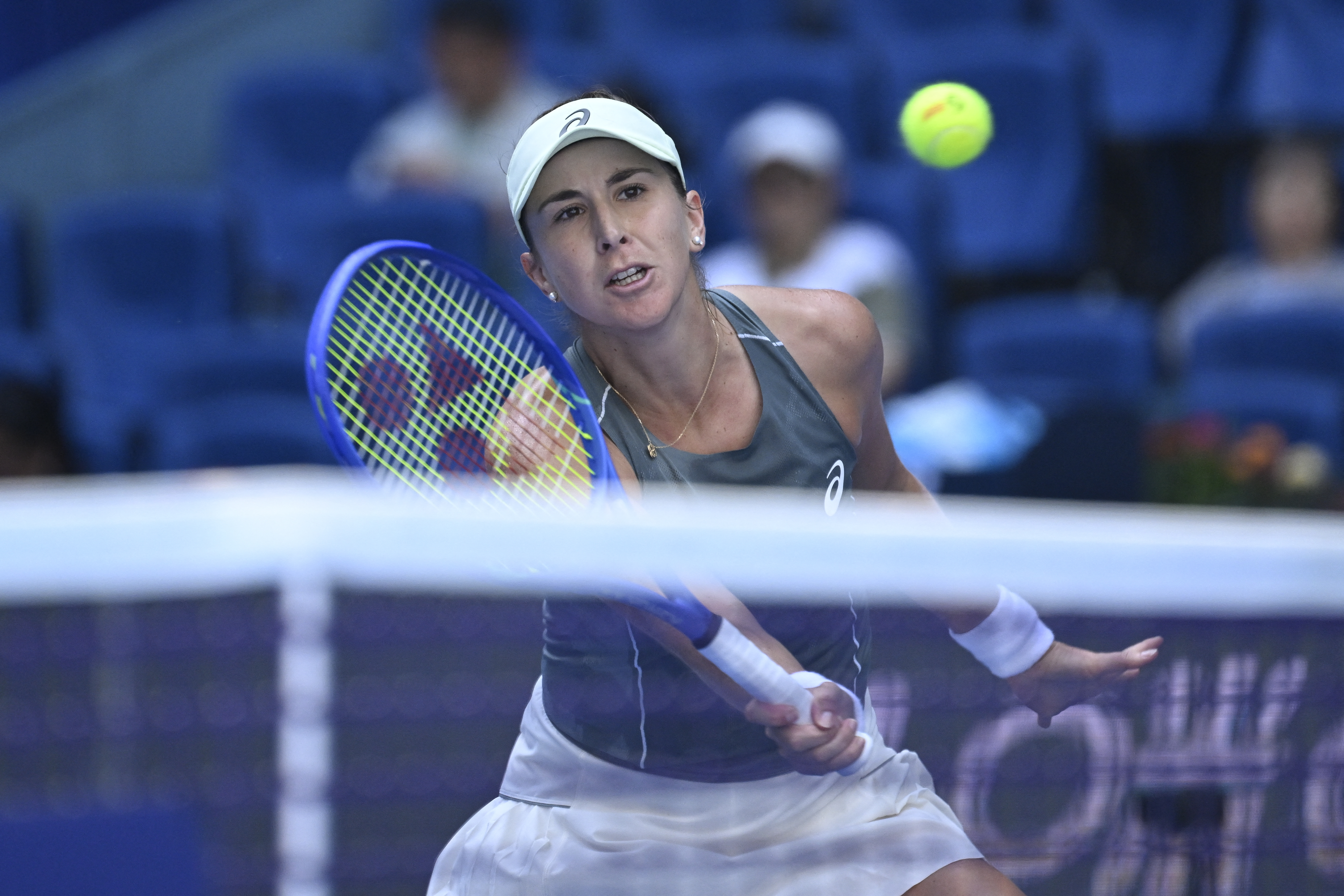 Switzerland's Belinda Bencic hits a return to USA's Coco Gauff during their women's singles match at the China Open tennis tournament in Beijing on September 30, 2025. (Photo by WANG Zhao / AFP)