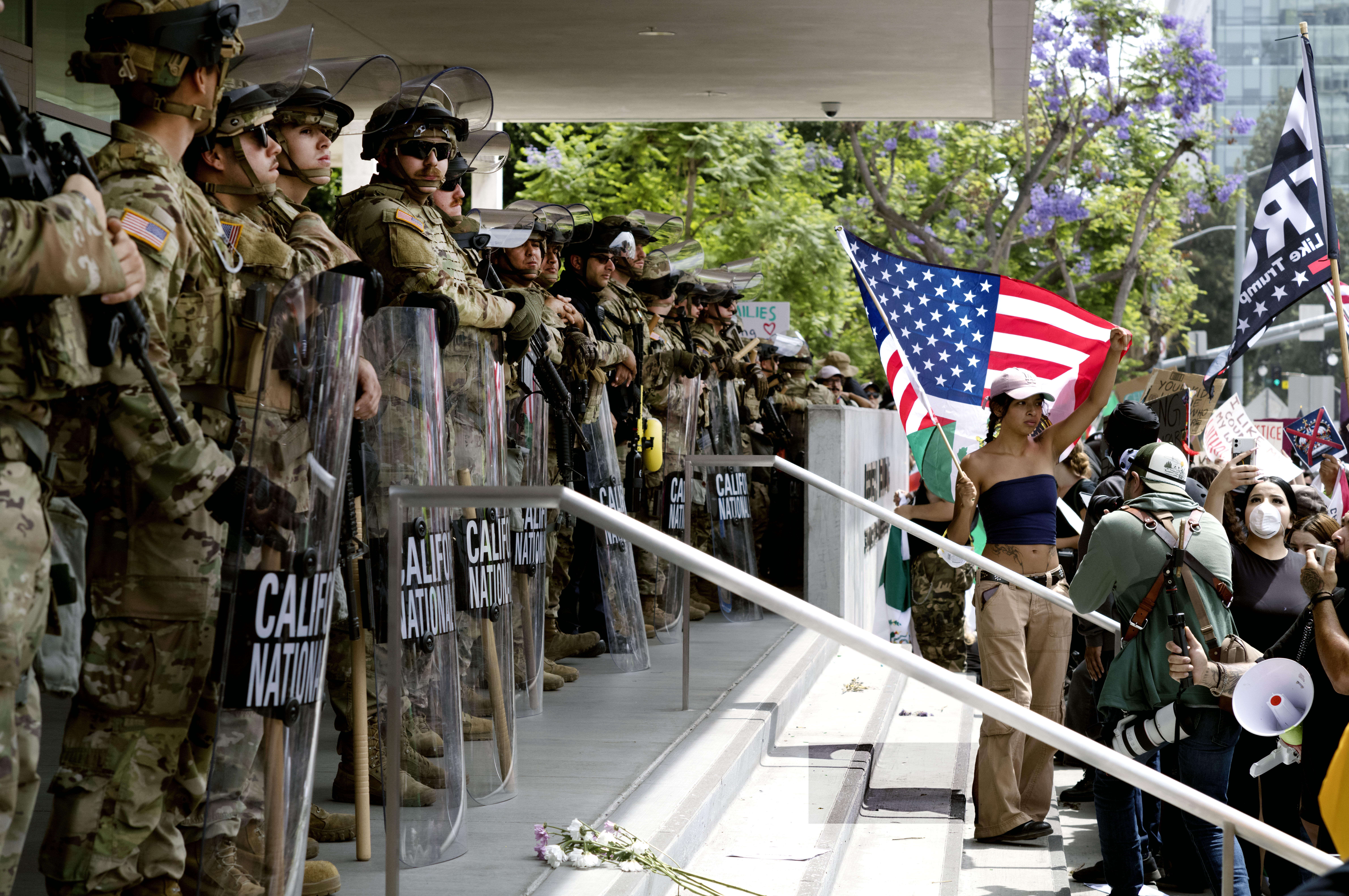 FILE - Protesters stand off against California National Guard soldiers at the Federal Building in downtown Los Angeles during a "No Kings" protest, June 14, 2025. (AP Photo/Richard Vogel, File)