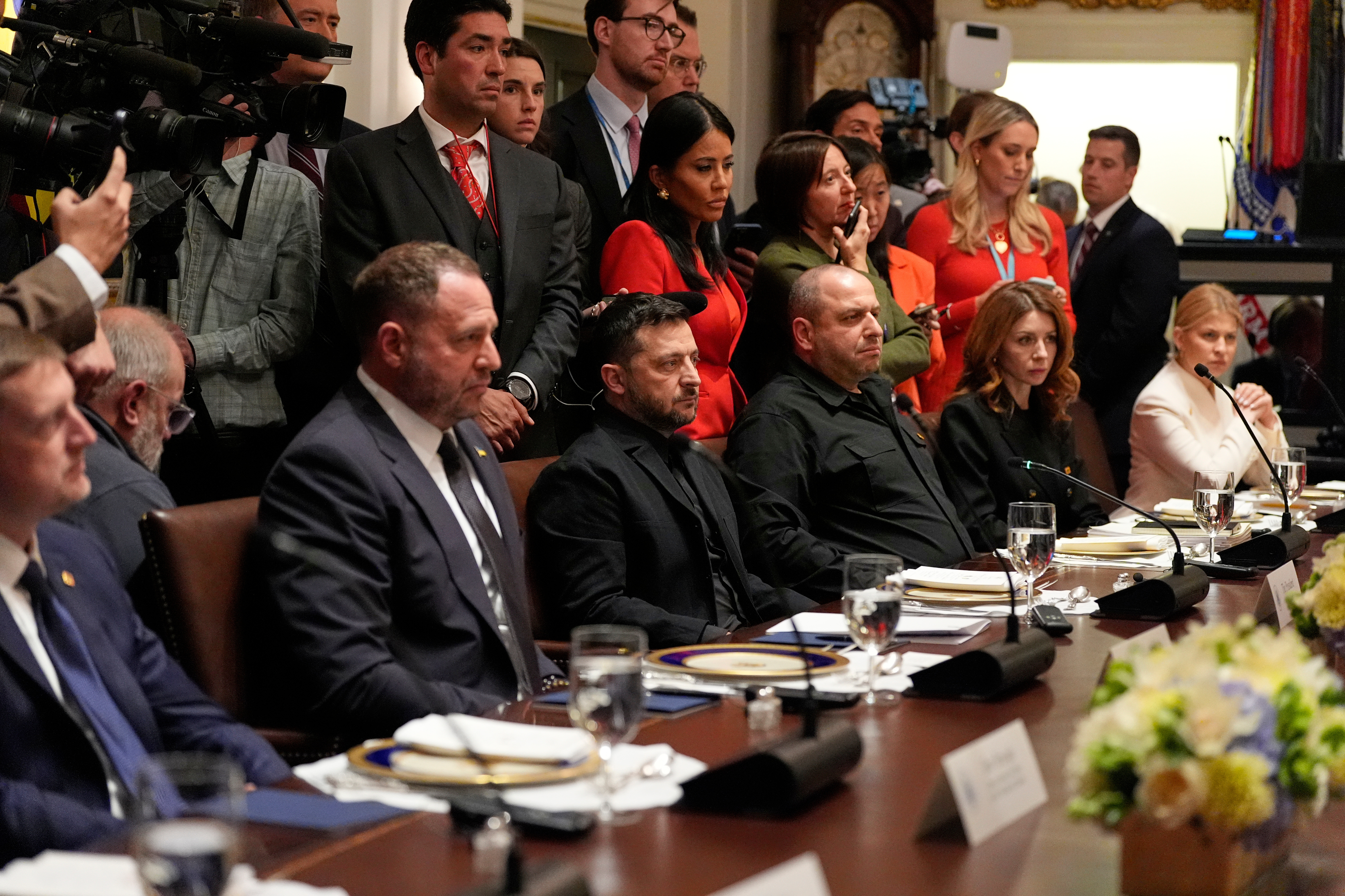 Ukraine's President Volodymyr Zelenskyy, seated third from left, listens as President Donald Trump speaks before a lunch in the Cabinet Room of the White House, Friday, Oct. 17, 2025, in Washington. (AP Photo/Alex Brandon)