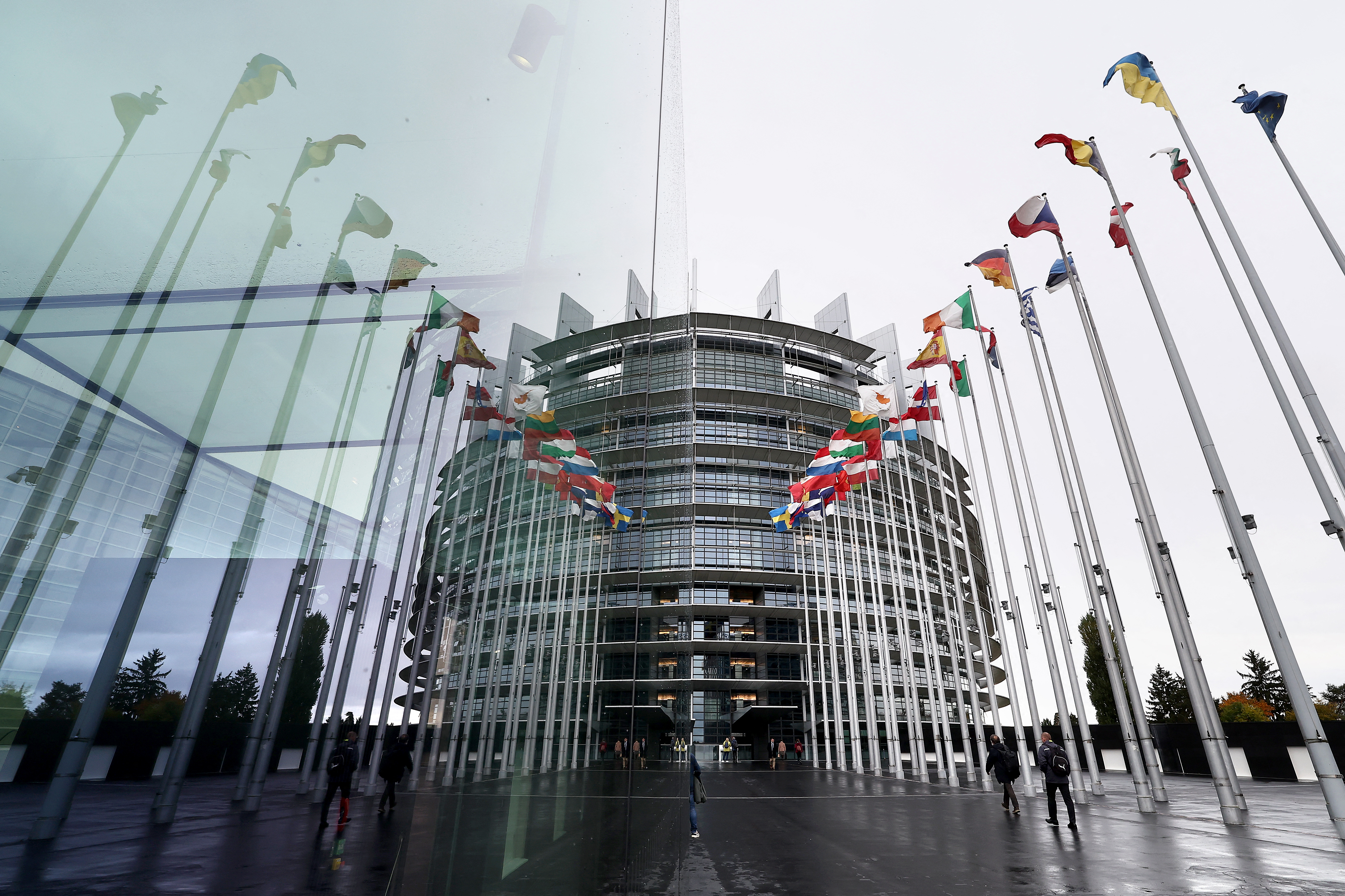 This photograph shows European countries' flags displayed in front of the European Parliament in Strasbourg, eastern France, on October 21, 2025. (Photo by FREDERICK FLORIN / AFP)