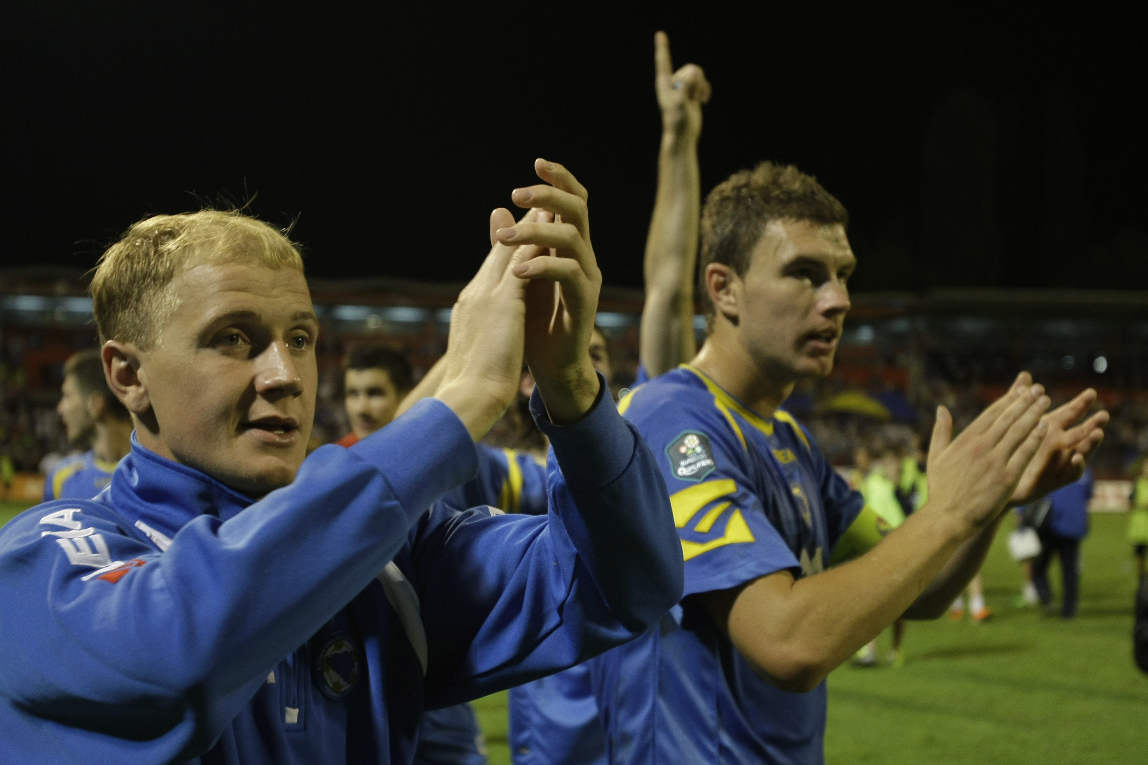 Bosnia's Senijad Ibricic,left, and Edin Dzeko,right, celebrate victory over ,Belarus , with 1: 0during their Euro 2012 Group D qualifying soccer match in Zenica, Bosnia, on Tuesday, Sep. 06, 2011.(AP Photo/Amel Emric)
