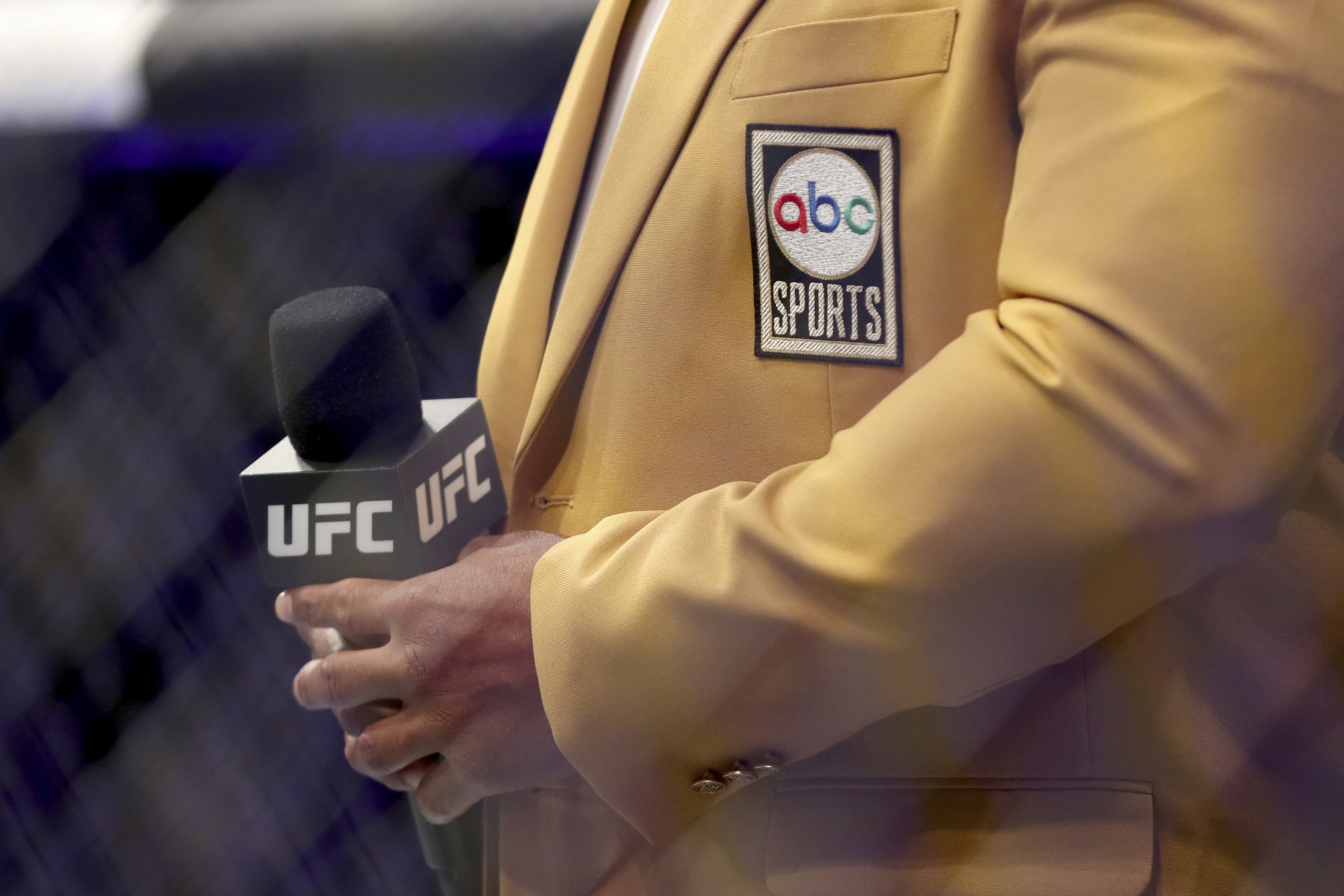 An ABC Sports logo and UFC logo on a microphone are seen at UFC on ABC 3, Saturday, July 16, 2022, in Elmont, NY. (AP Photo/Gregory Payan)