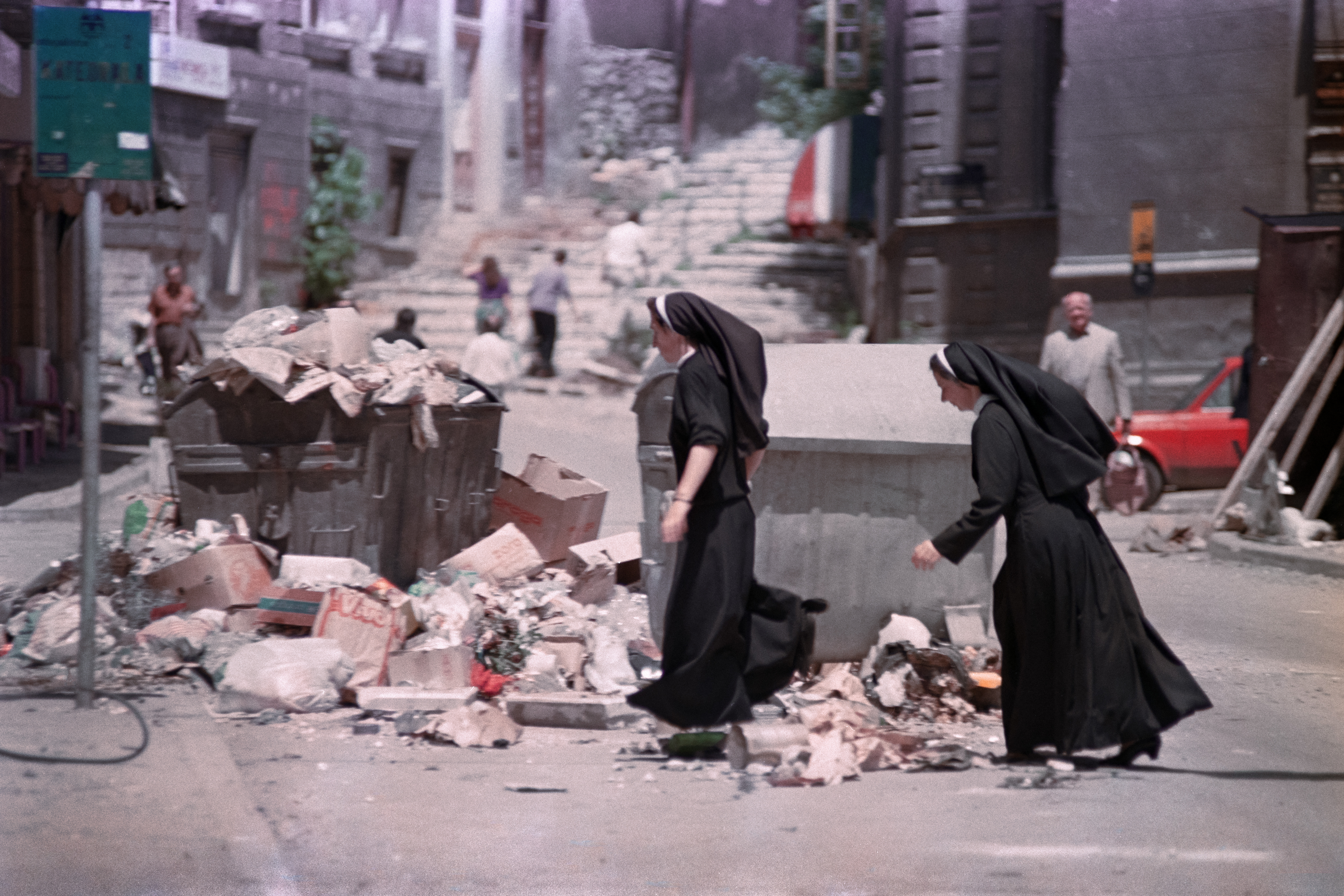 Two nuns walk through a street of Sarajevo on June 21, 1992.