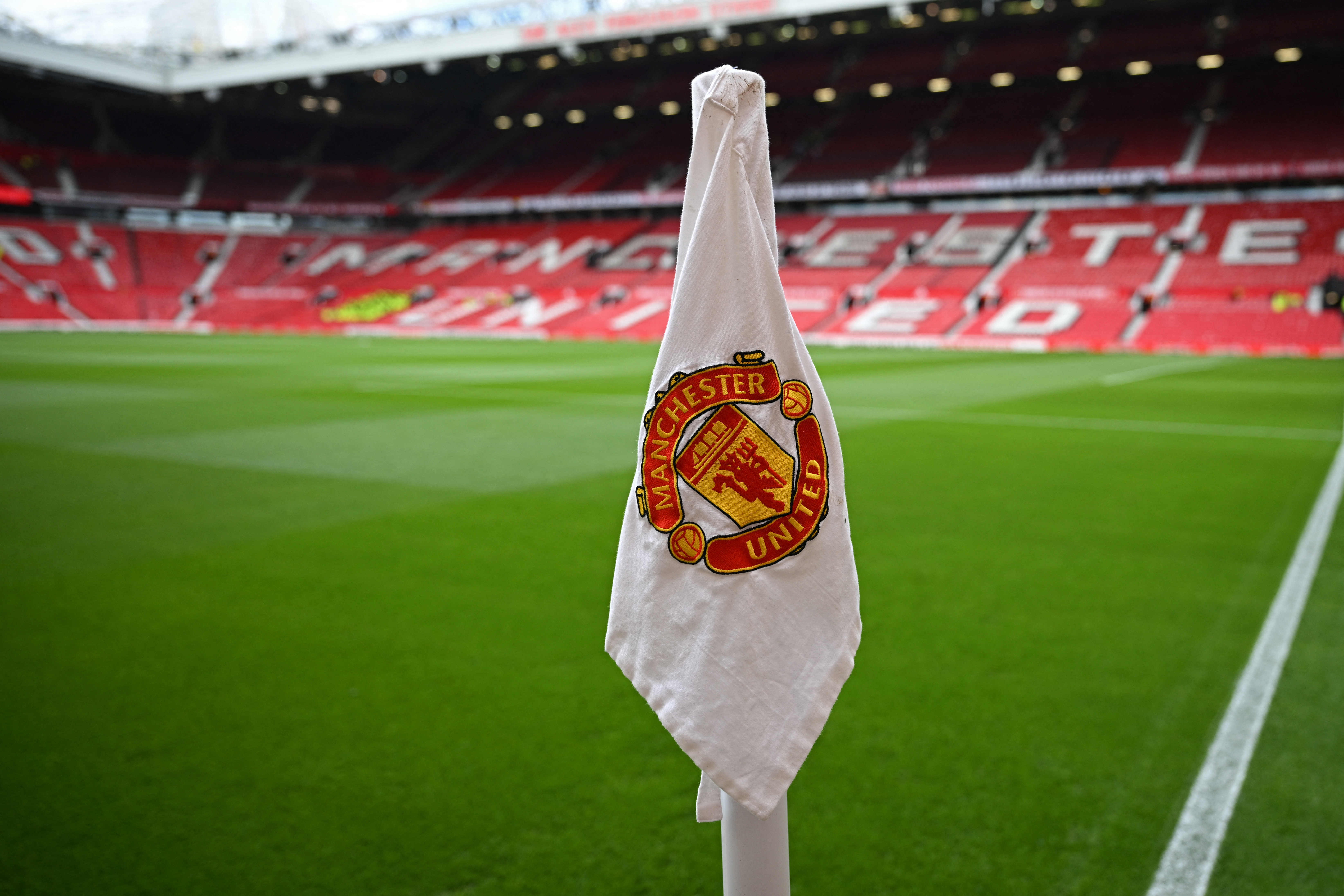 A limp corner flag displaying the Manchester United crest
