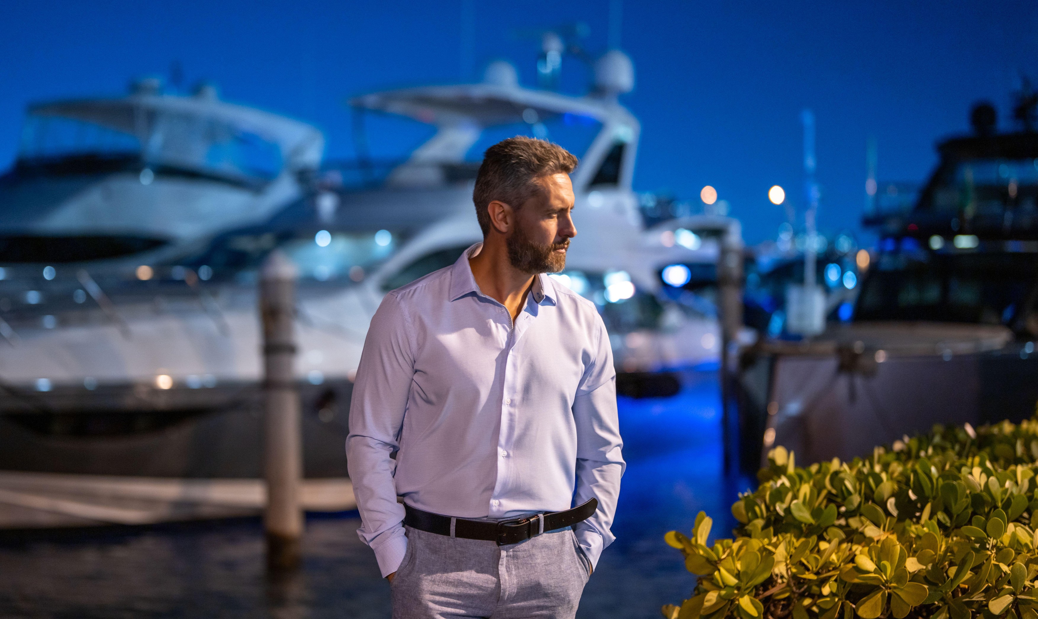 Rich billionaire man near yacht