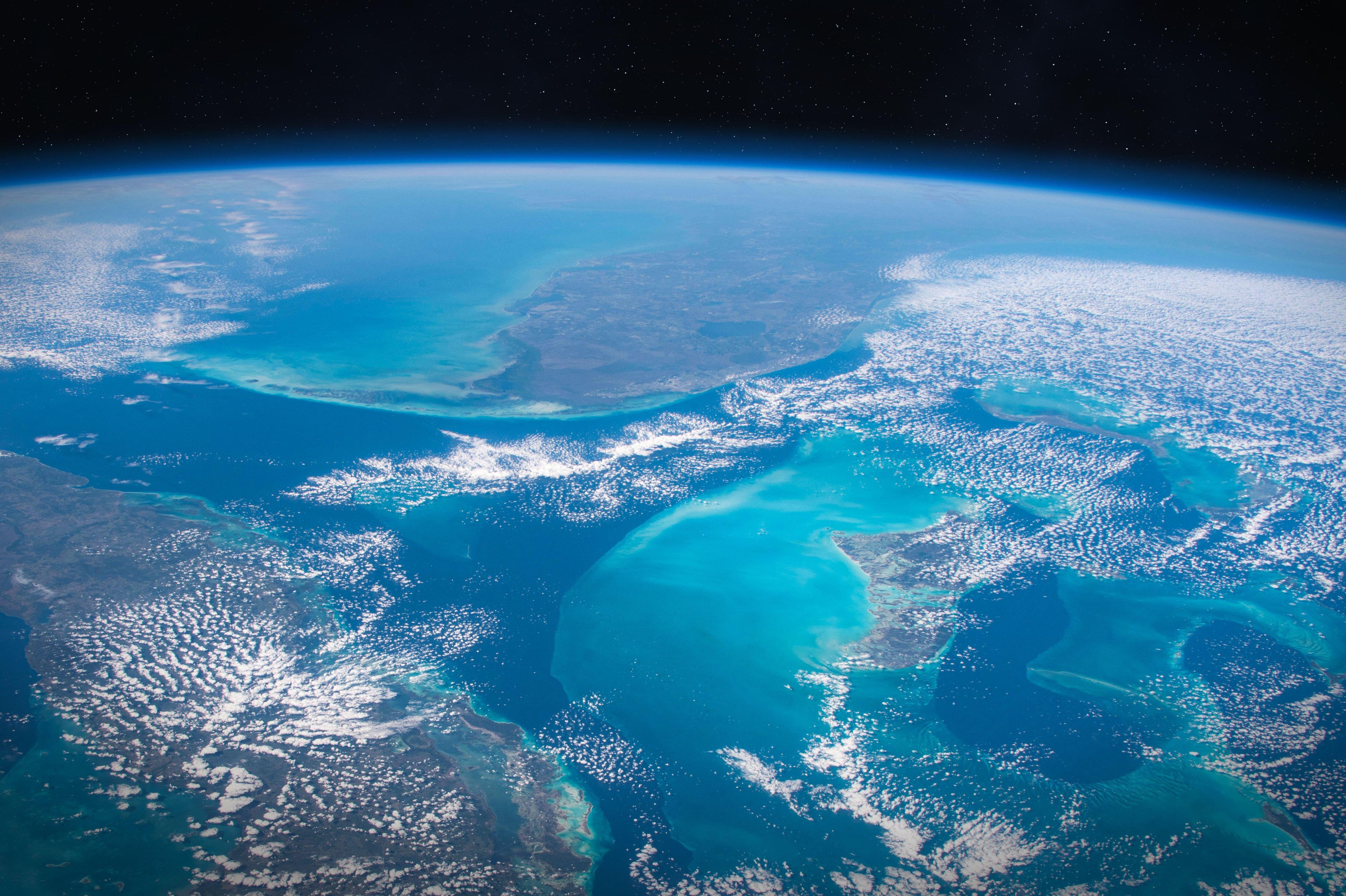 Earth in space. The surface of the planet Earth with the teal blue waters