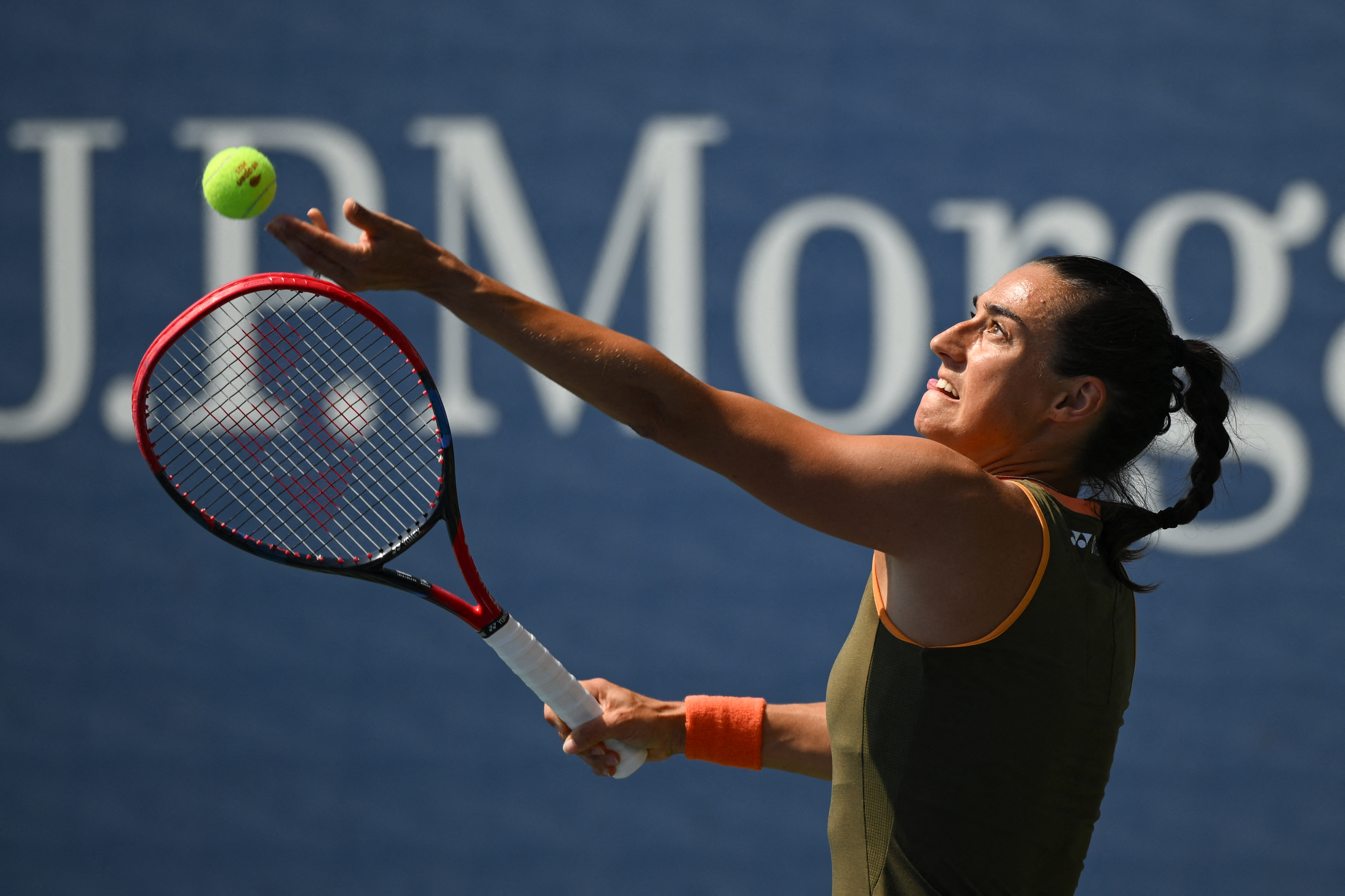 France's Caroline Garcia serves to Russia's Kamilla Rakhimova during their