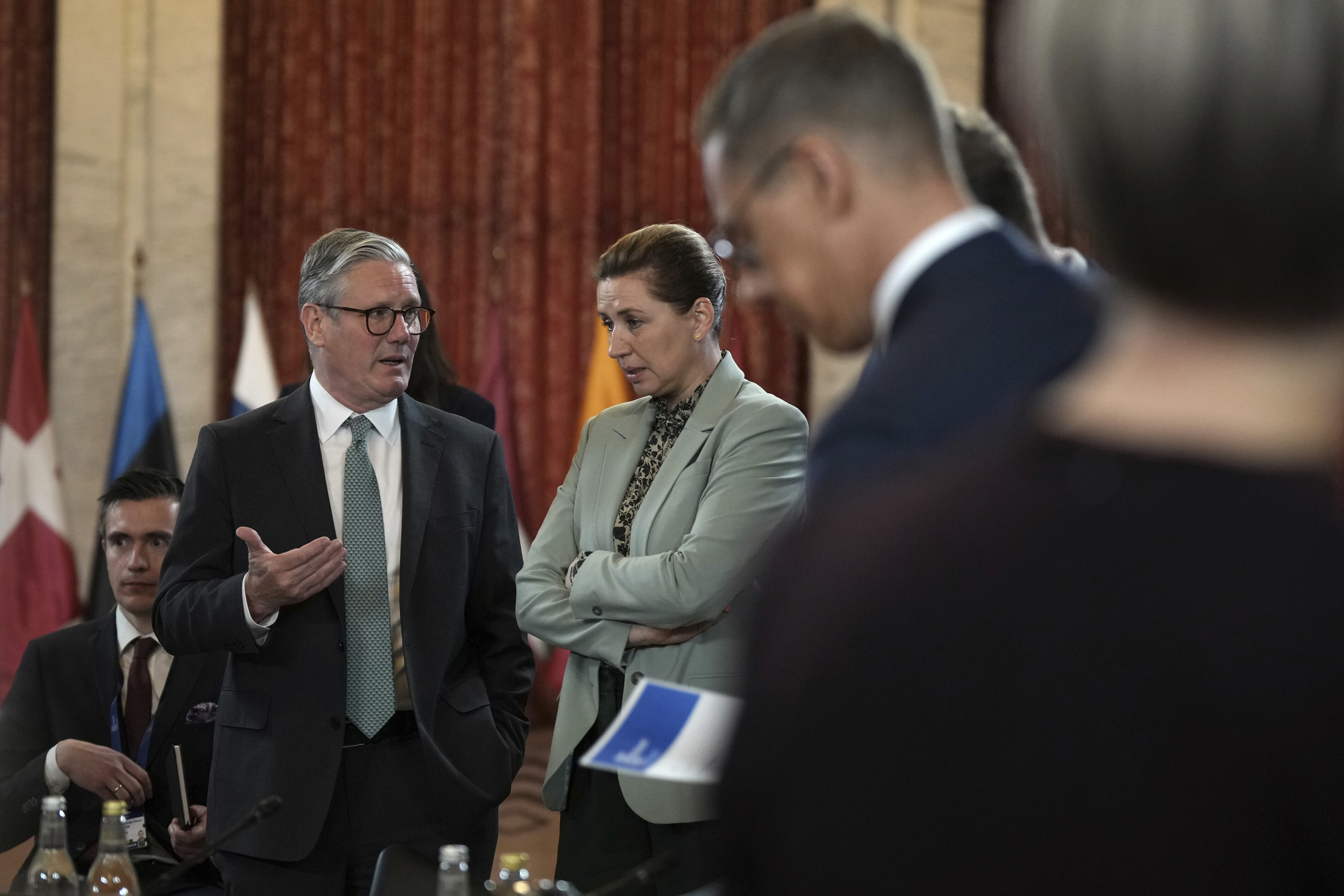 Britain's Prime Minister Keir Starmer talks to Danish Prime Minister Mette Frederiksen during the Joint Expeditionary Force (JEF) Leaders' Summit in Oslo, Friday, May 9, 2025.(AP Photo/Alastair Grant, Pool)